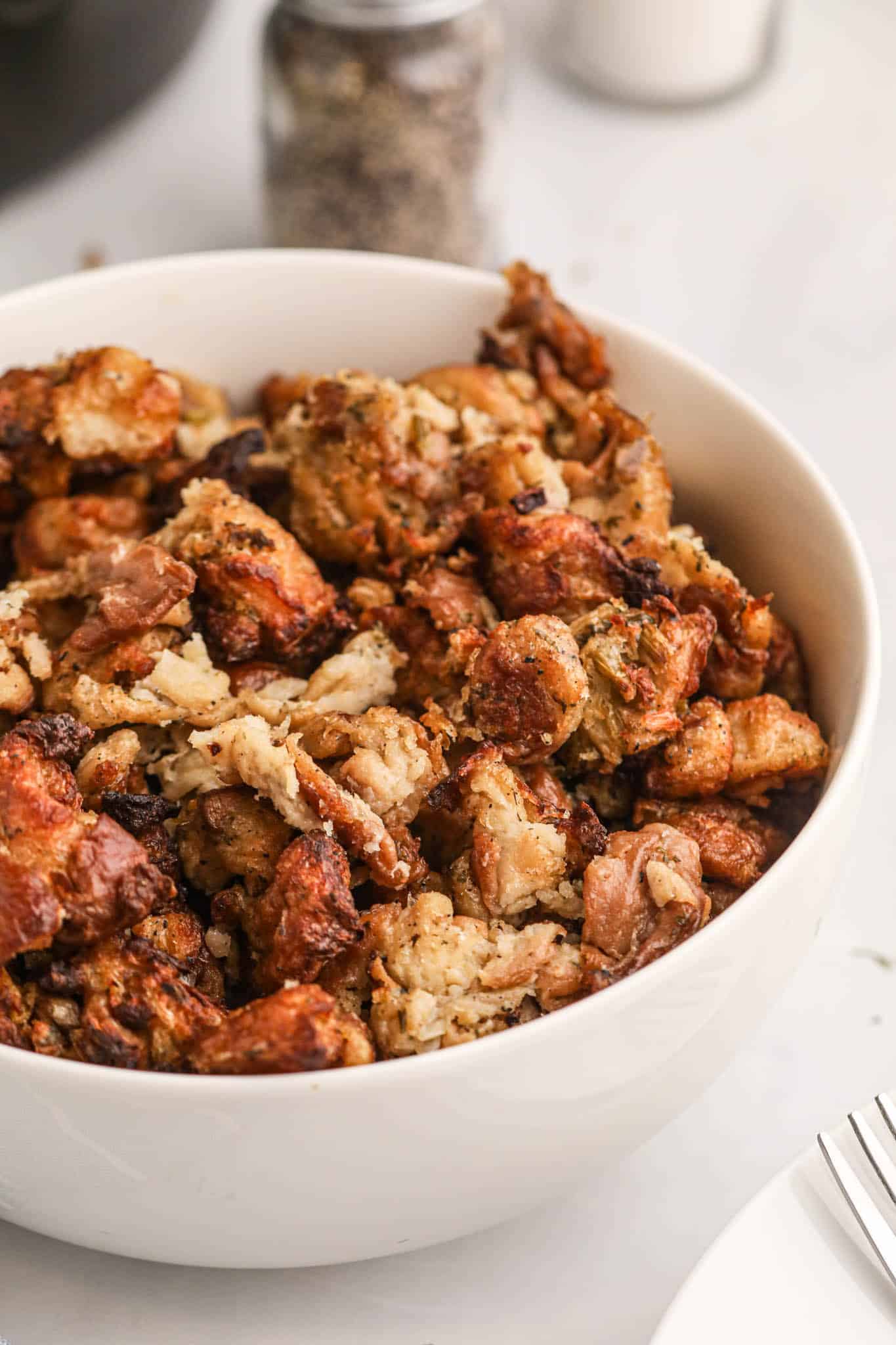 Crock Pot Stuffing is the perfect slow cooker holiday side dish made with packaged stuffing bread cubes, chicken broth, butter, celery, onions and spices.