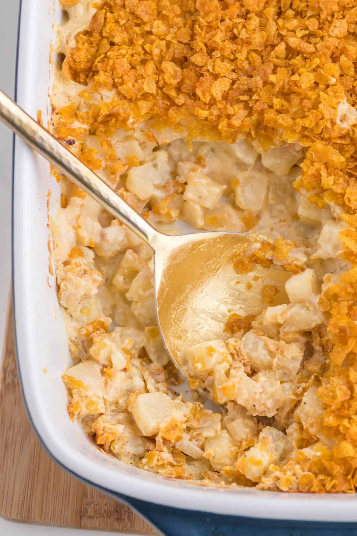 Funeral Potatoes are a delicious side dish with frozen diced hash brown potatoes baked in a creamy, cheesy mixture and topped with crushed cornflakes.