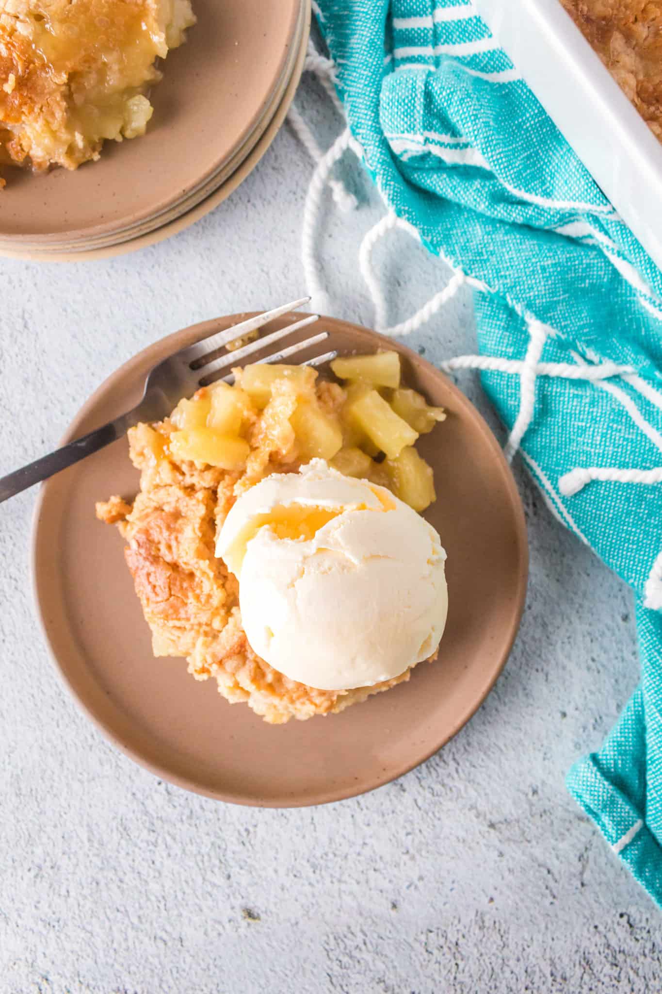 Pineapple Dump Cake is an easy dessert recipe using canned pineapple and boxed cake mix.