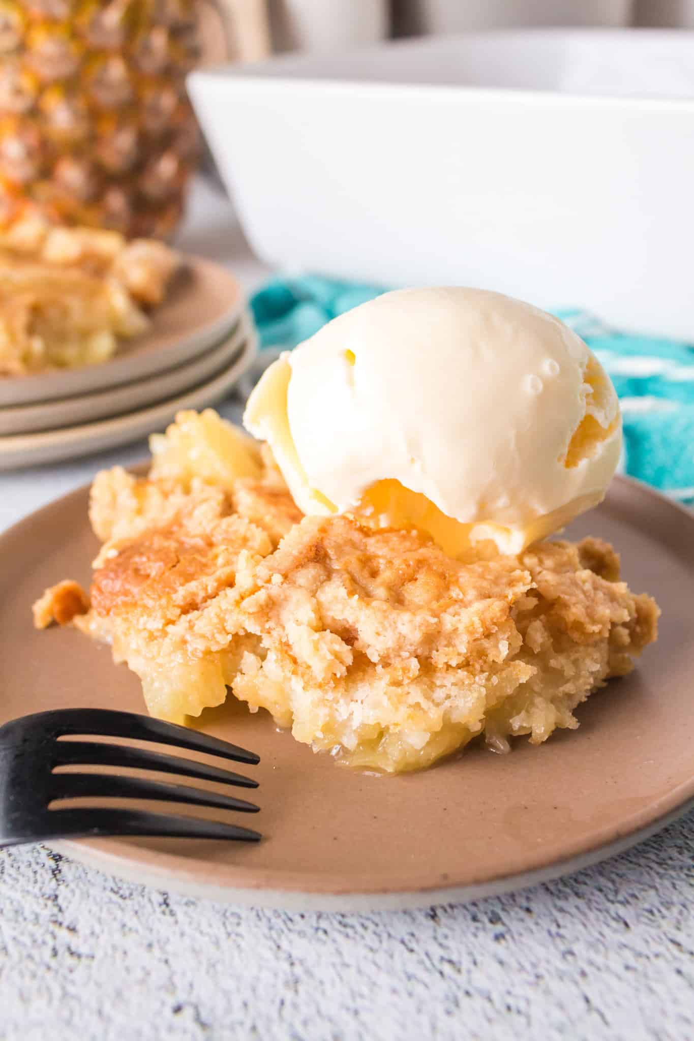 Pineapple Dump Cake is an easy dessert recipe using canned pineapple and boxed cake mix.