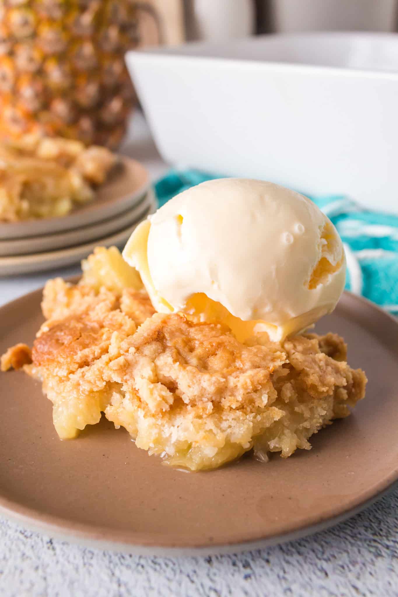 Pineapple Dump Cake is an easy dessert recipe using canned pineapple and boxed cake mix.