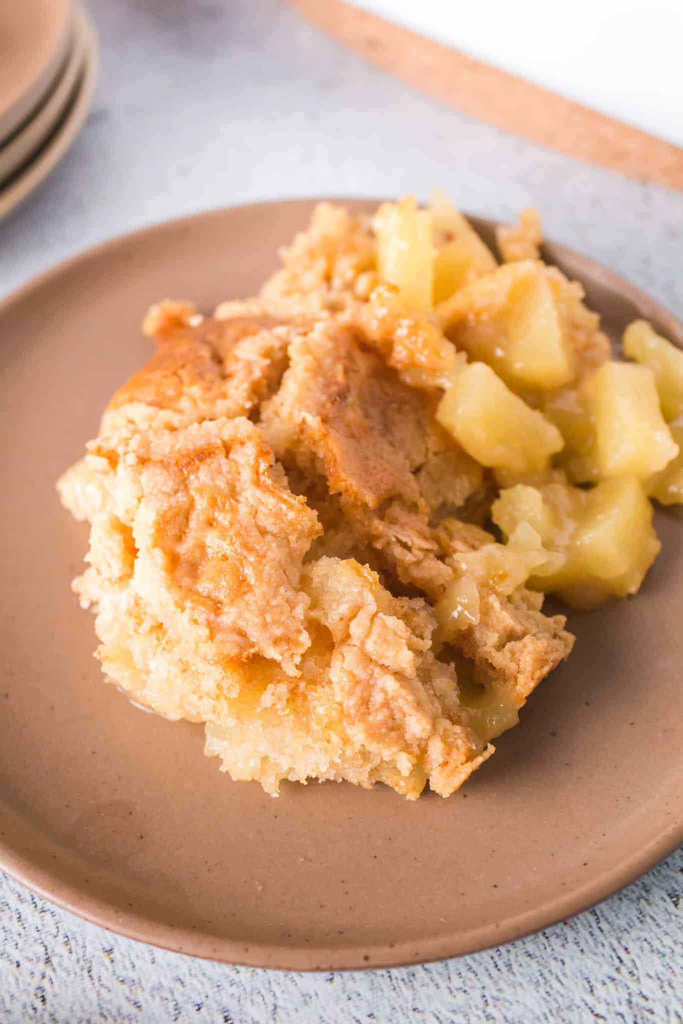 Pineapple Dump Cake is an easy dessert recipe using canned pineapple and boxed cake mix.