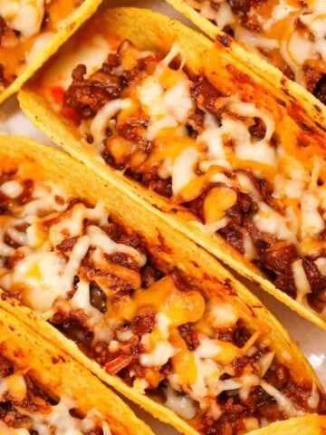 Sloppy Joe Tacos are hearty ground beef tacos with sloppy joe sauce and baked with cheese.