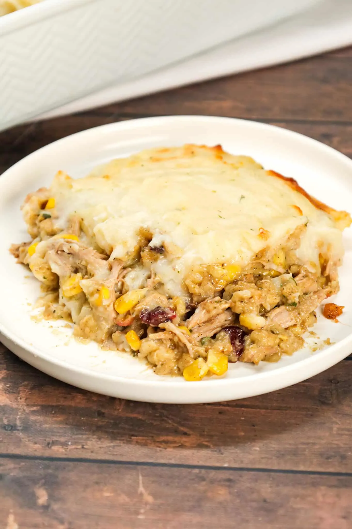 Turkey Shepherd's Pie is a hearty dinner recipe loaded with shredded turkey, corn, Stove Top stuffing mix, cream of chicken soup, cranberries and topped with mashed potatoes.