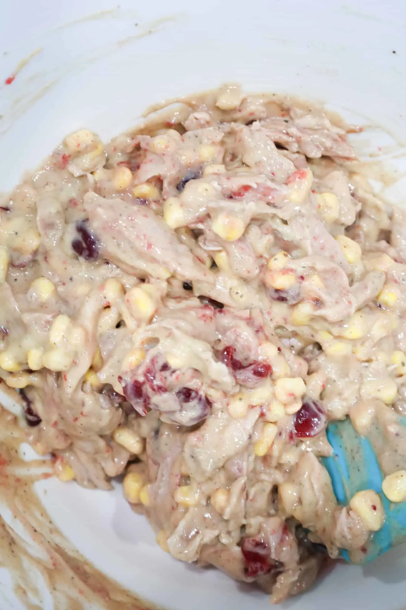 shredded turkey, corn, cranberry sauce and cream of chicken soup mixture in a mixing bowl