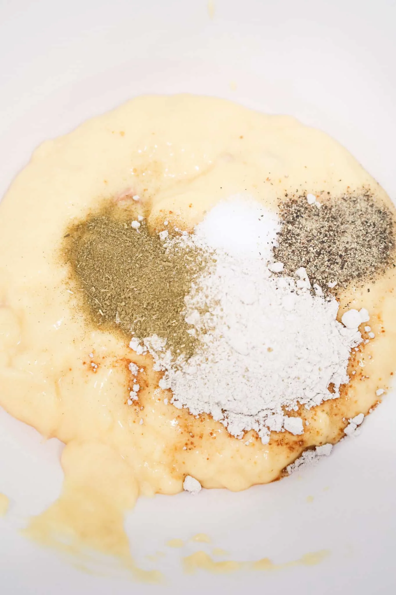 cream of chicken soup and seasonings in a mixing bowl