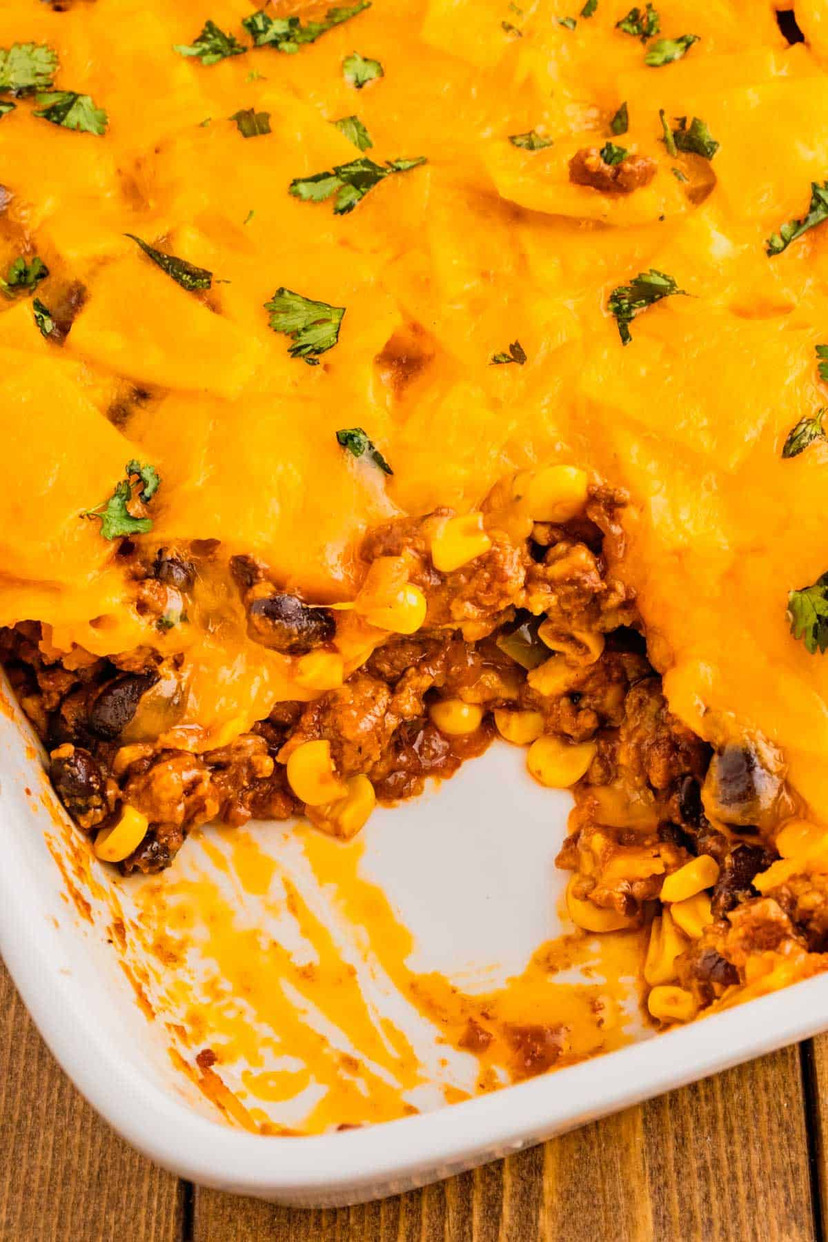 Beef Enchilada Casserole is an easy ground beef casserole recipe loaded with corn, black beans, corn tortillas, enchilada sauce and cheddar cheese.