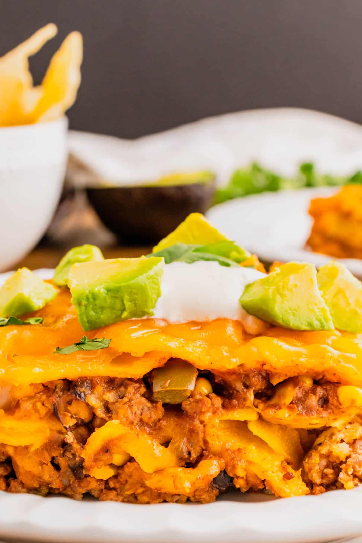 Beef Enchilada Casserole is an easy ground beef casserole recipe loaded with corn, black beans, corn tortillas, enchilada sauce and cheddar cheese.