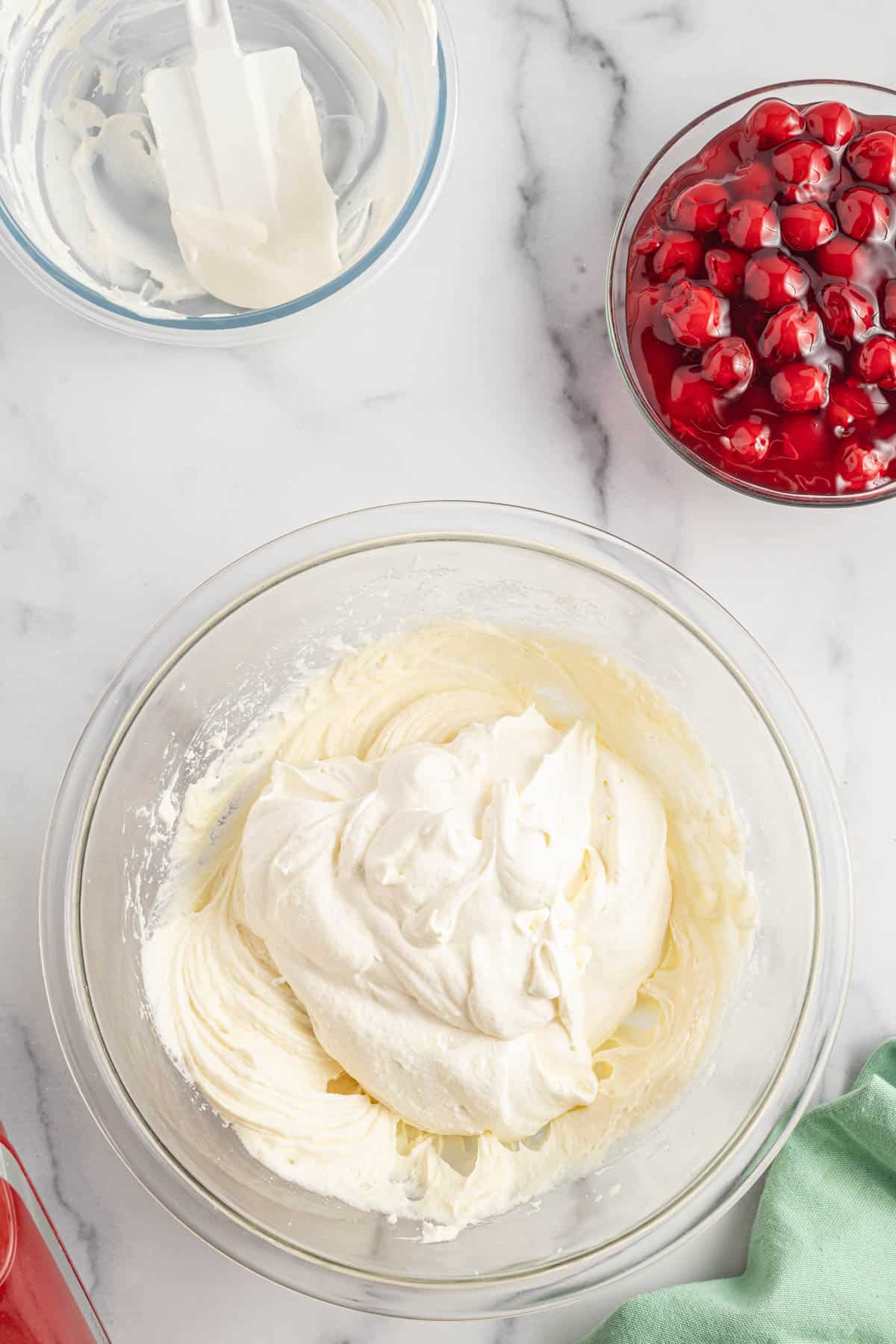 Cool Whip added to mixing bowl with cream cheese mixture