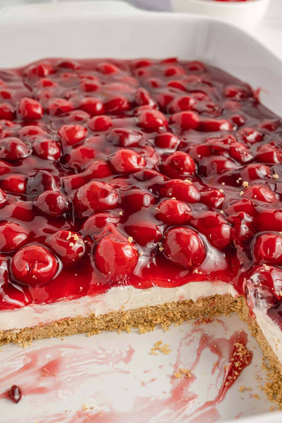 Cherry Delight is an easy no bake dessert with a graham crumb base, cream cheese and Cool Whip filling and topped with canned cherry pie filling.