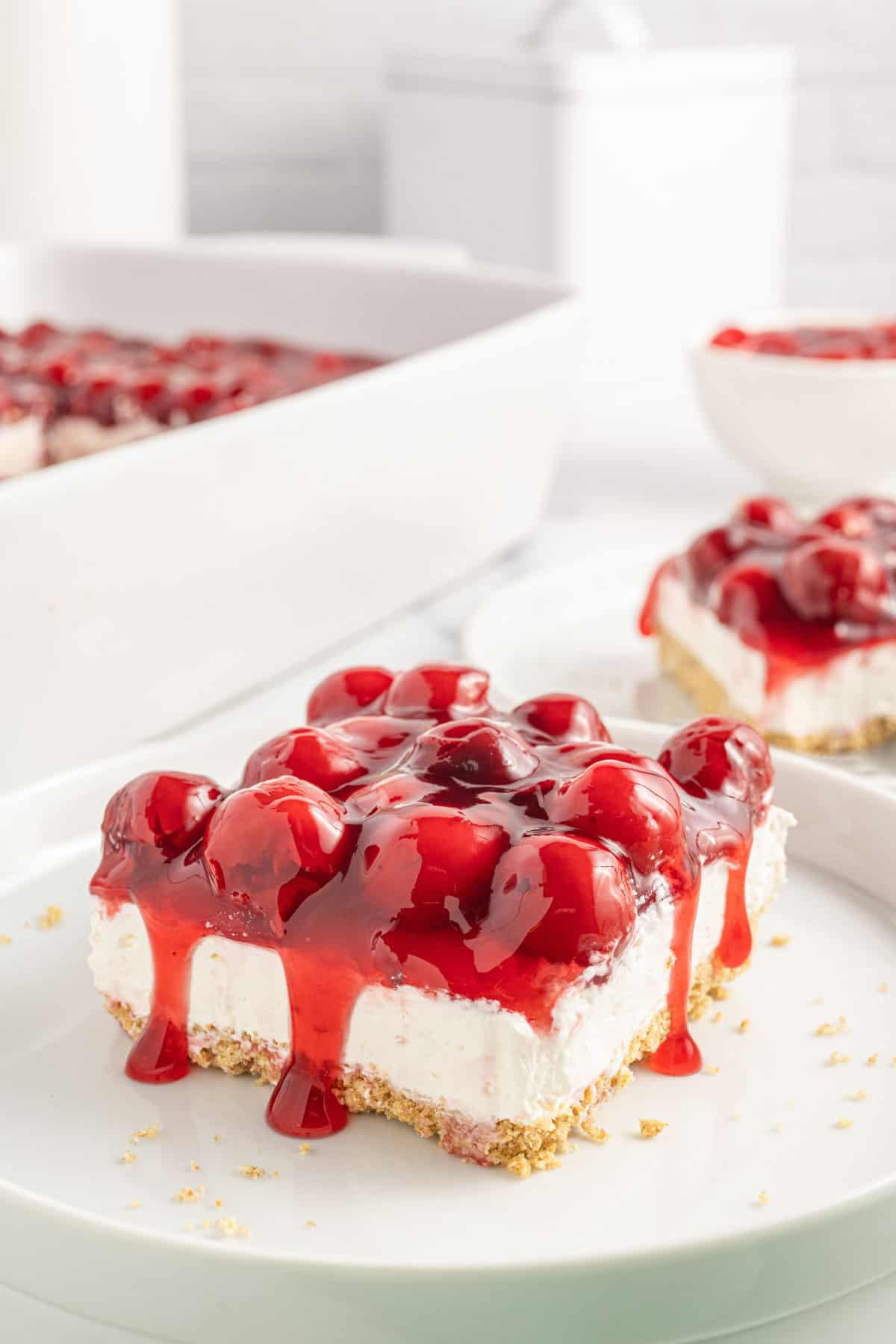 Cherry Delight is an easy no bake dessert with a graham crumb base, cream cheese and Cool Whip filling and topped with canned cherry pie filling.