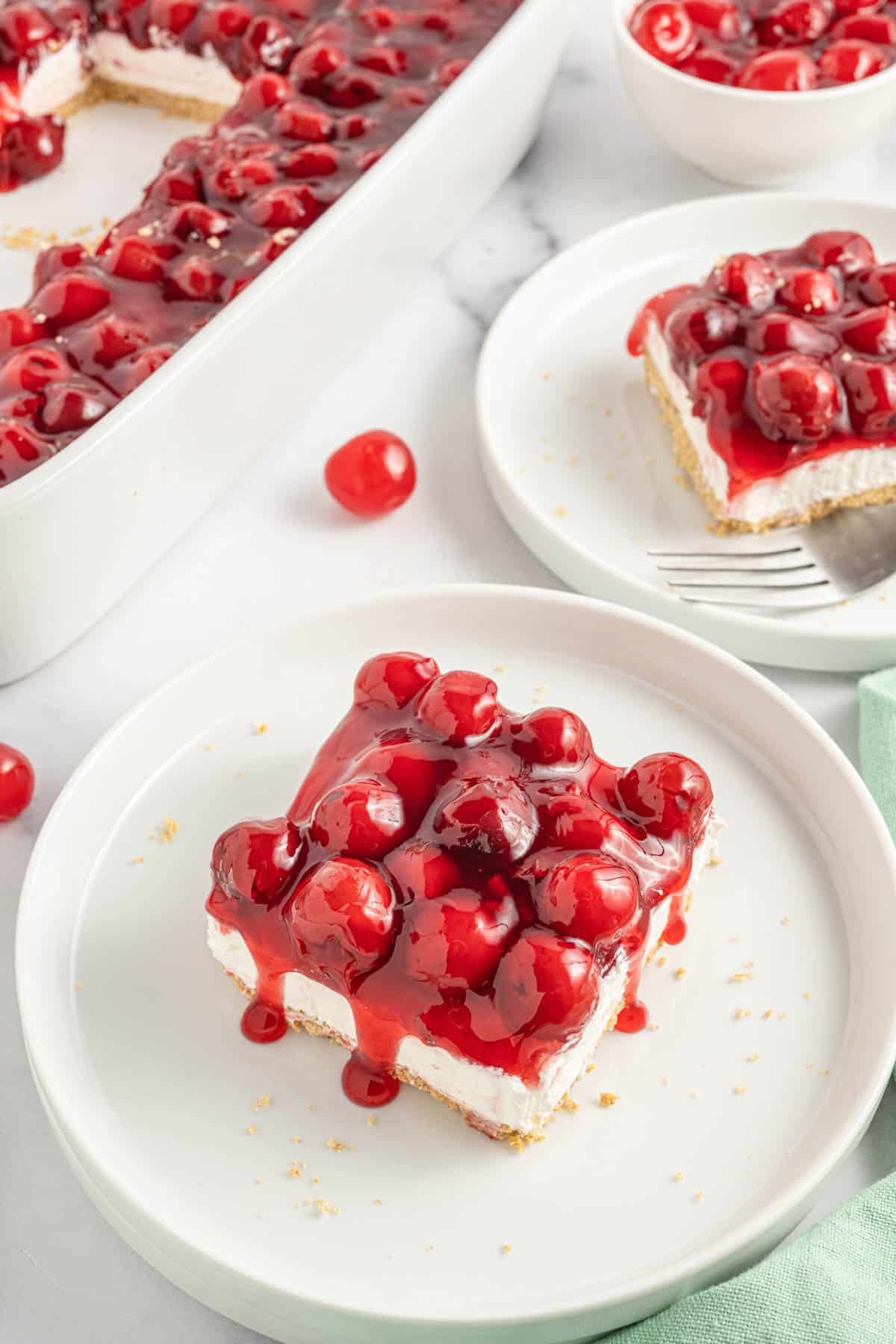 Cherry Delight is an easy no bake dessert with a graham crumb base, cream cheese and Cool Whip filling and topped with canned cherry pie filling.
