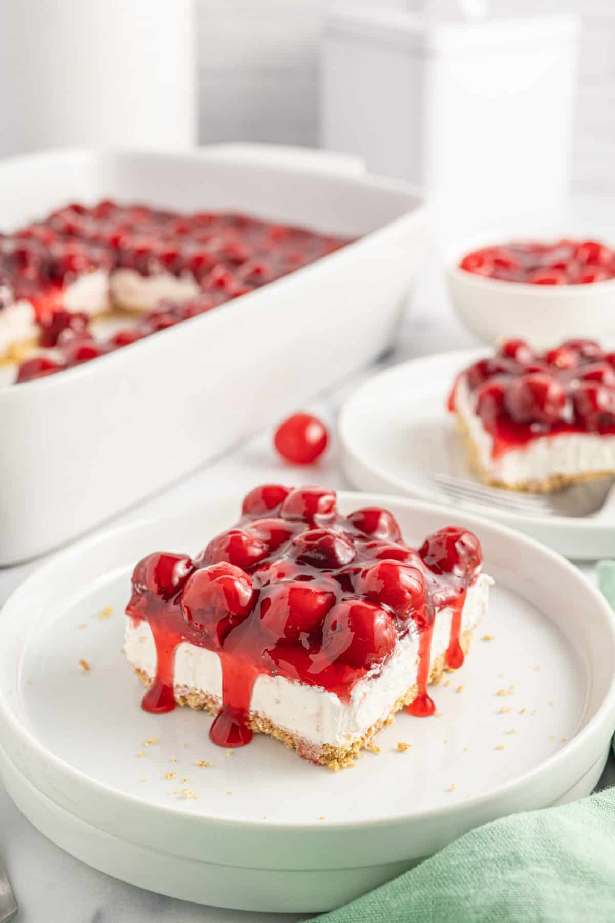 Cherry Delight is an easy no bake dessert with a graham crumb base, cream cheese and Cool Whip filling and topped with canned cherry pie filling.