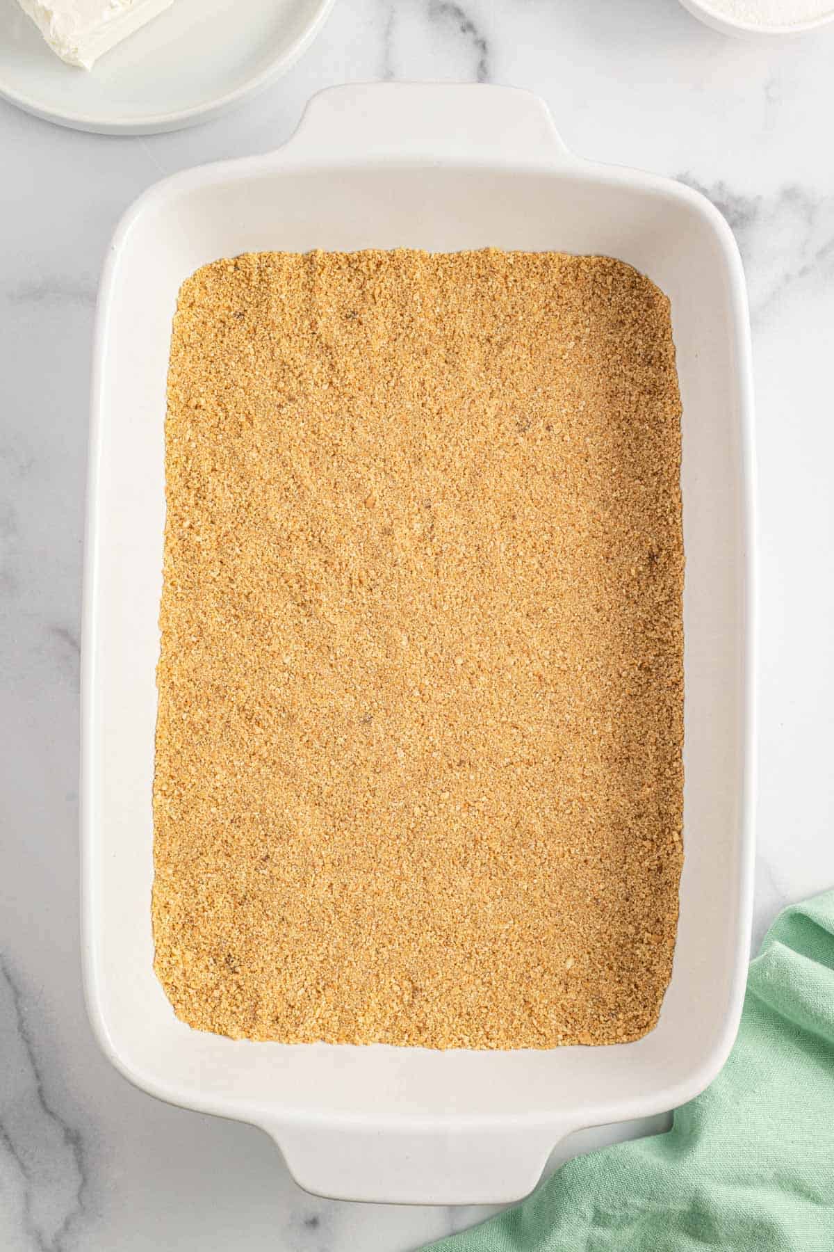 graham crumb base in a baking dish