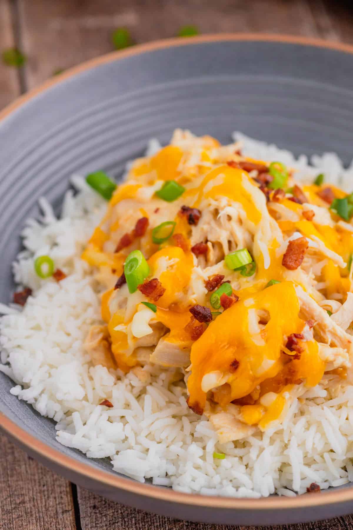 Crock Pot Crack Chicken is a creamy slow cooker chicken dish loaded with ranch dressing, shredded chicken, cream cheese, bacon, shredded cheese and chopped green onions.