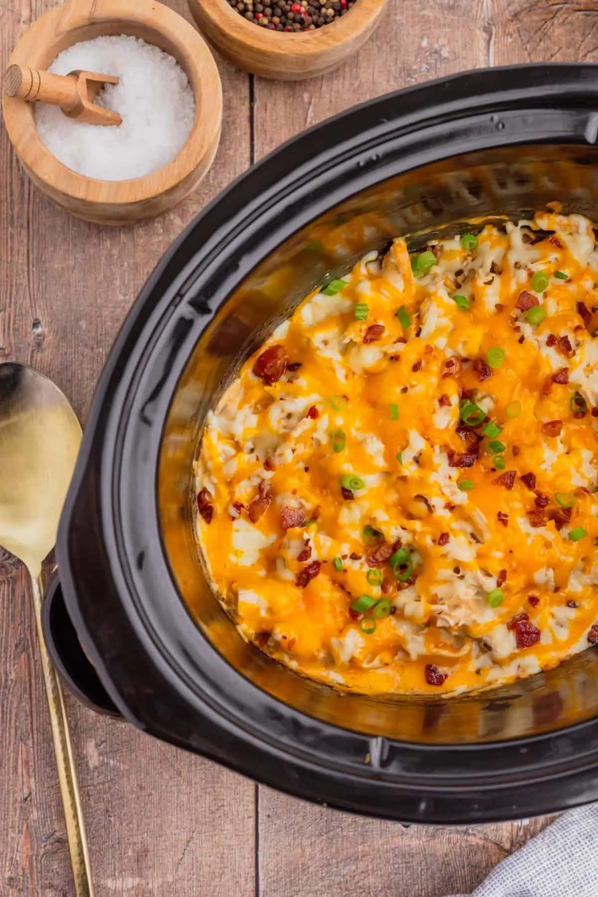 Crock Pot Crack Chicken is a creamy slow cooker chicken dish loaded with ranch dressing, shredded chicken, cream cheese, bacon, shredded cheese and chopped green onions.
