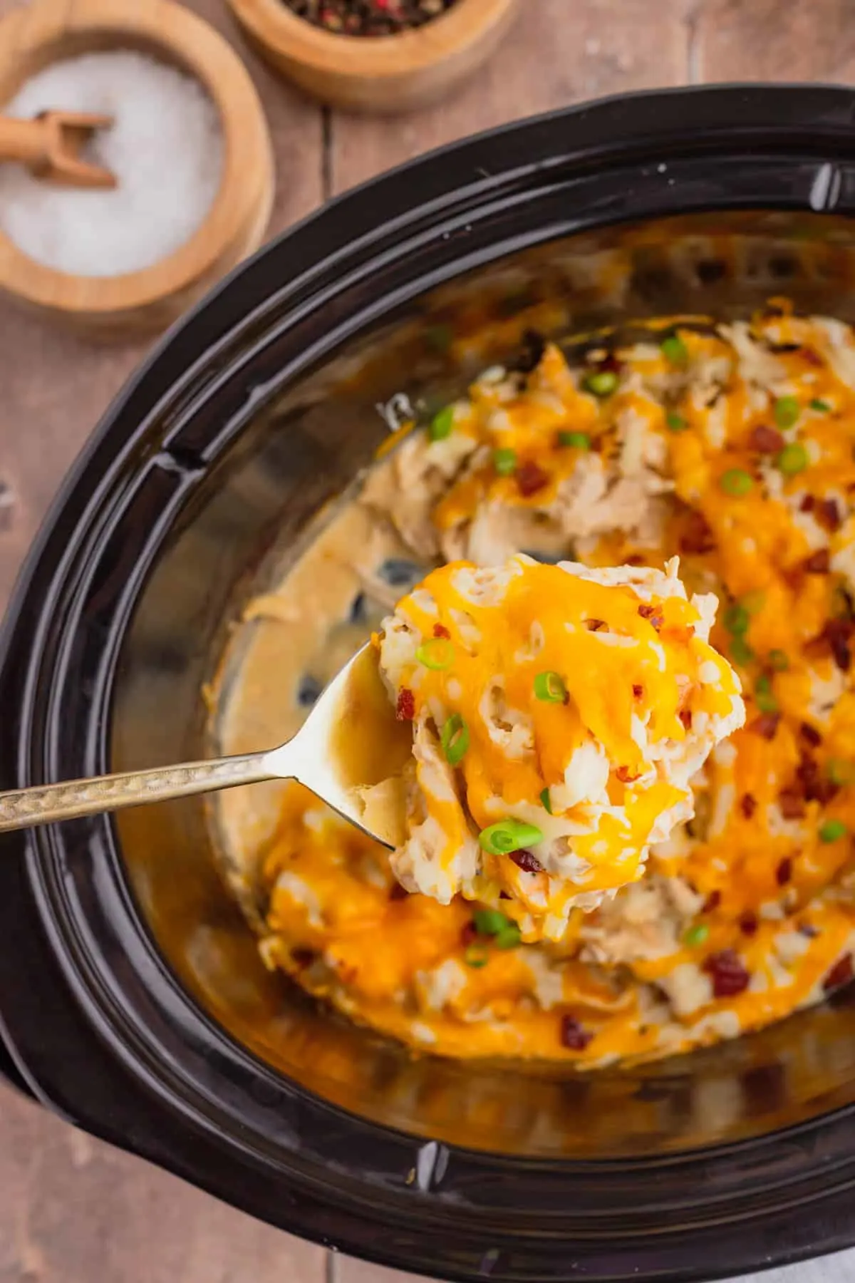 Crock Pot Crack Chicken is a creamy slow cooker chicken dish loaded with ranch dressing, shredded chicken, cream cheese, bacon, shredded cheese and chopped green onions.