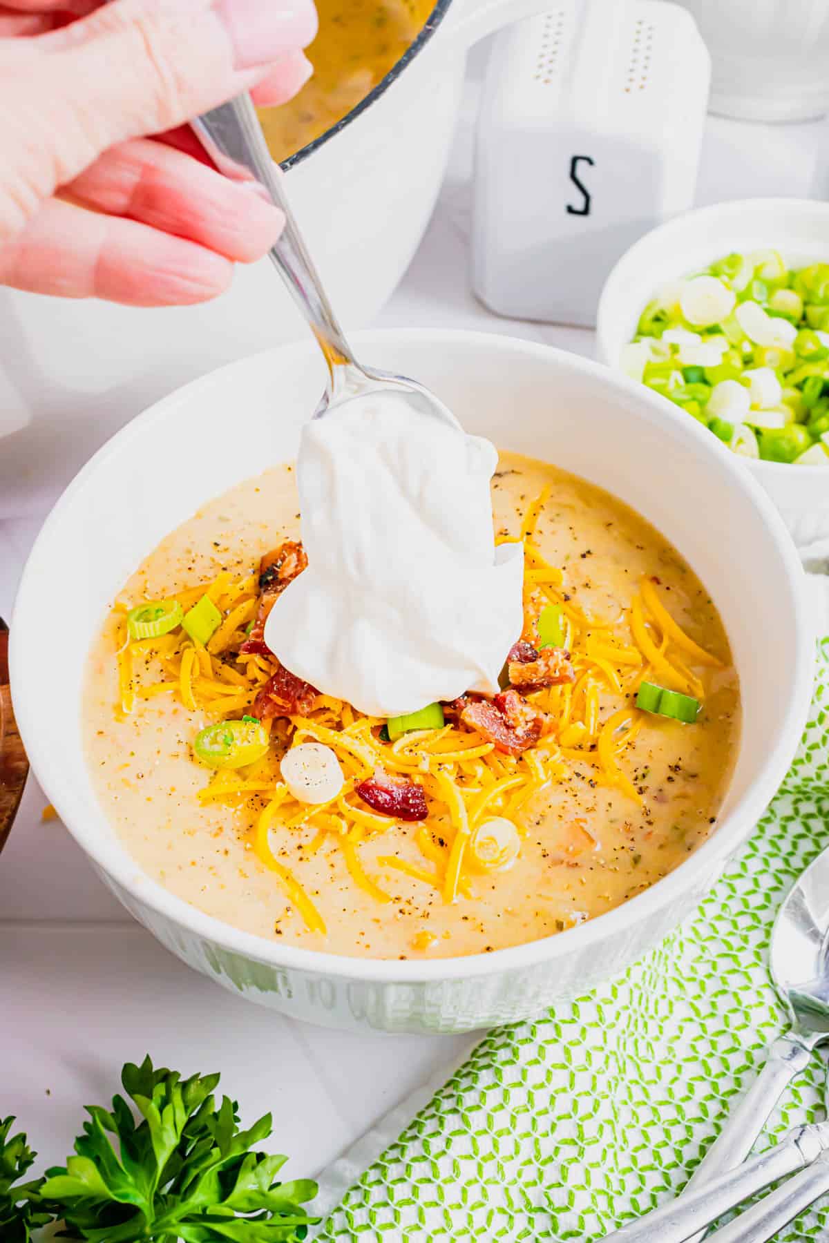 Loaded Baked Potato Soup is a hearty soup recipe loaded with russet potatoes, bacon, cheddar cheese, onions, chicken broth and cream.