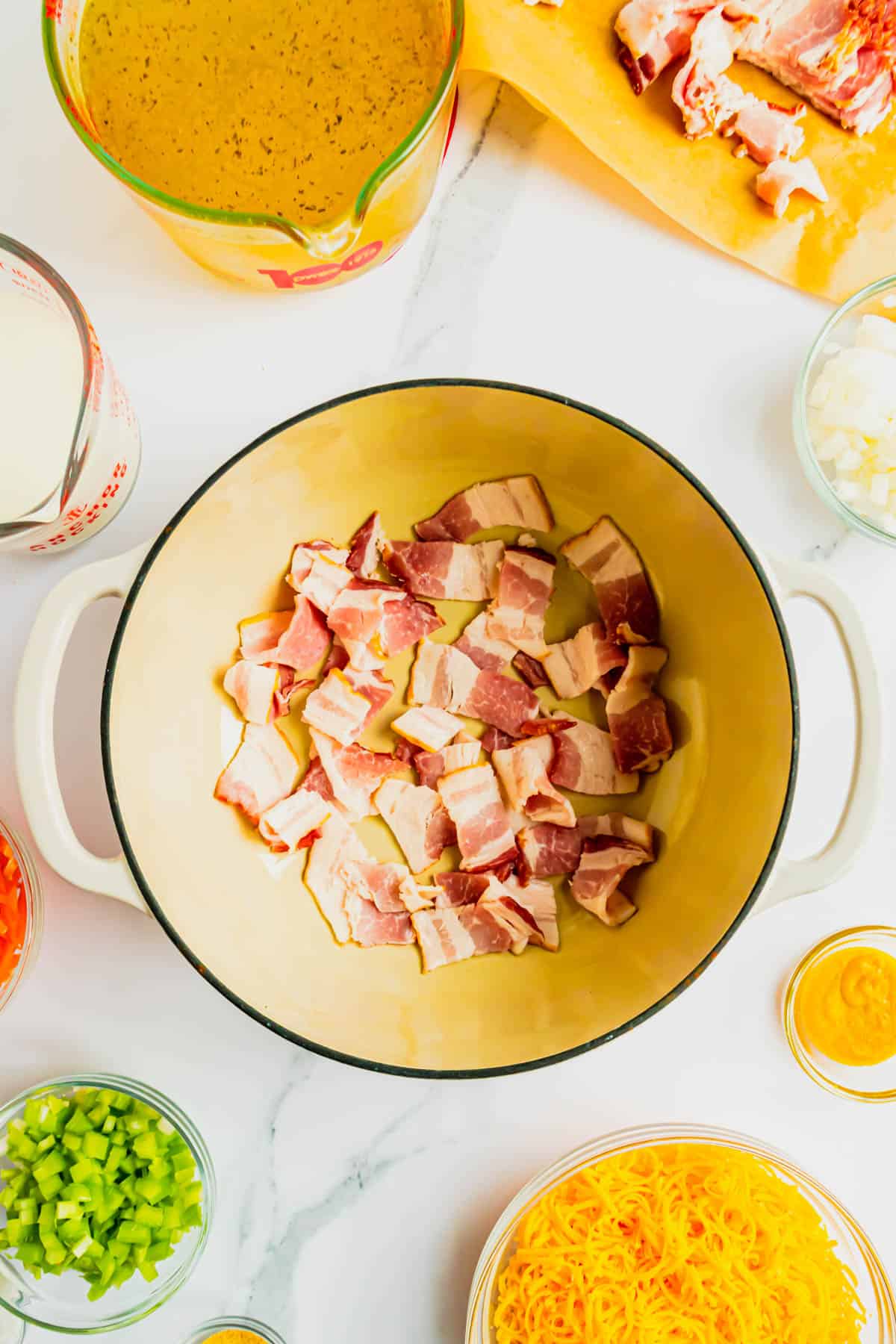 chopped bacon pieces in the bottom of a Dutch oven