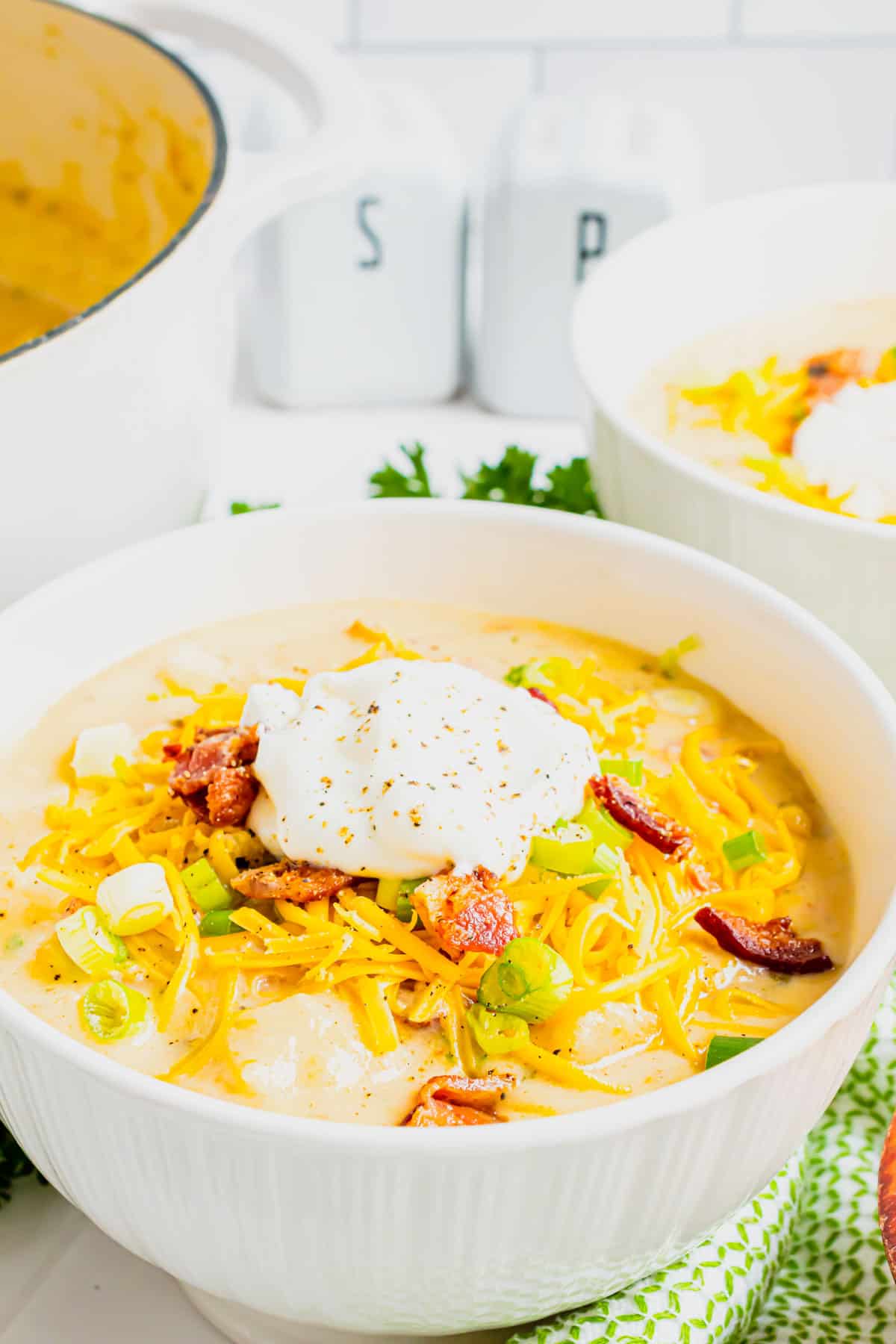 Loaded Baked Potato Soup is a hearty soup recipe loaded with russet potatoes, bacon, cheddar cheese, onions, chicken broth and cream.