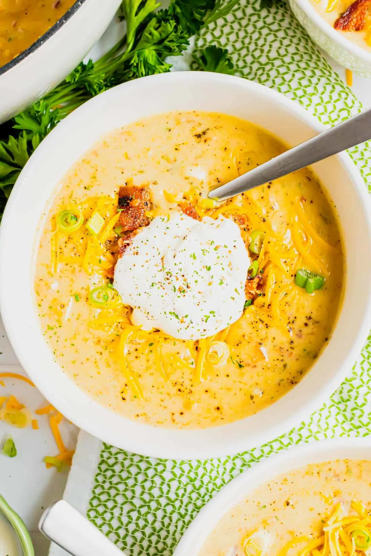 Loaded Baked Potato Soup is a hearty soup recipe loaded with russet potatoes, bacon, cheddar cheese, onions, chicken broth and cream.