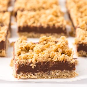 No Bake Chocolate Oat Bars are an easy 7 ingredient dessert recipe with layers of oats and a chocolate peanut butter center.