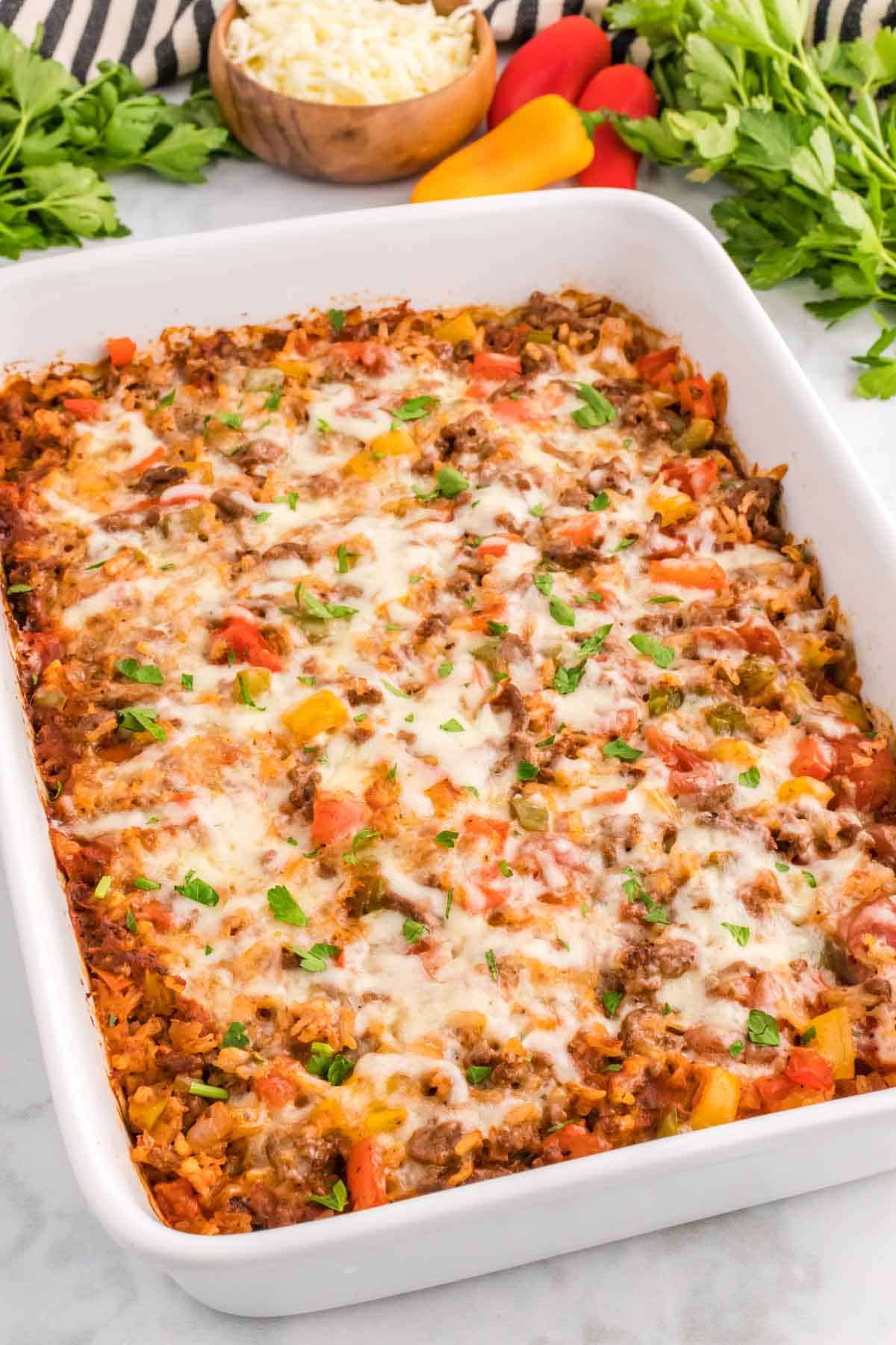 Stuffed Pepper Casserole is a hearty ground beef casserole loaded with diced bell peppers, white rice, diced tomatoes, tomato sauce and baked with mozzarella cheese on top.