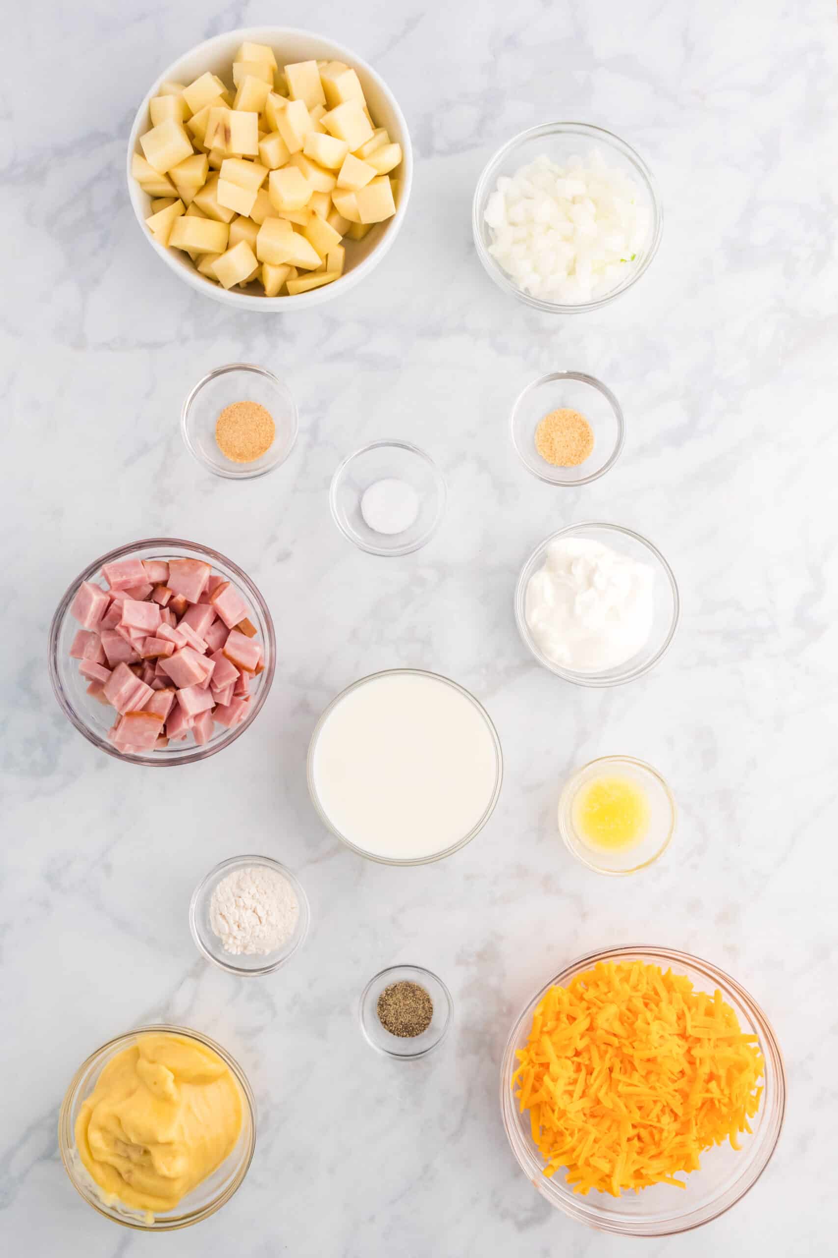 ham and potato casserole ingredients in prep bowls