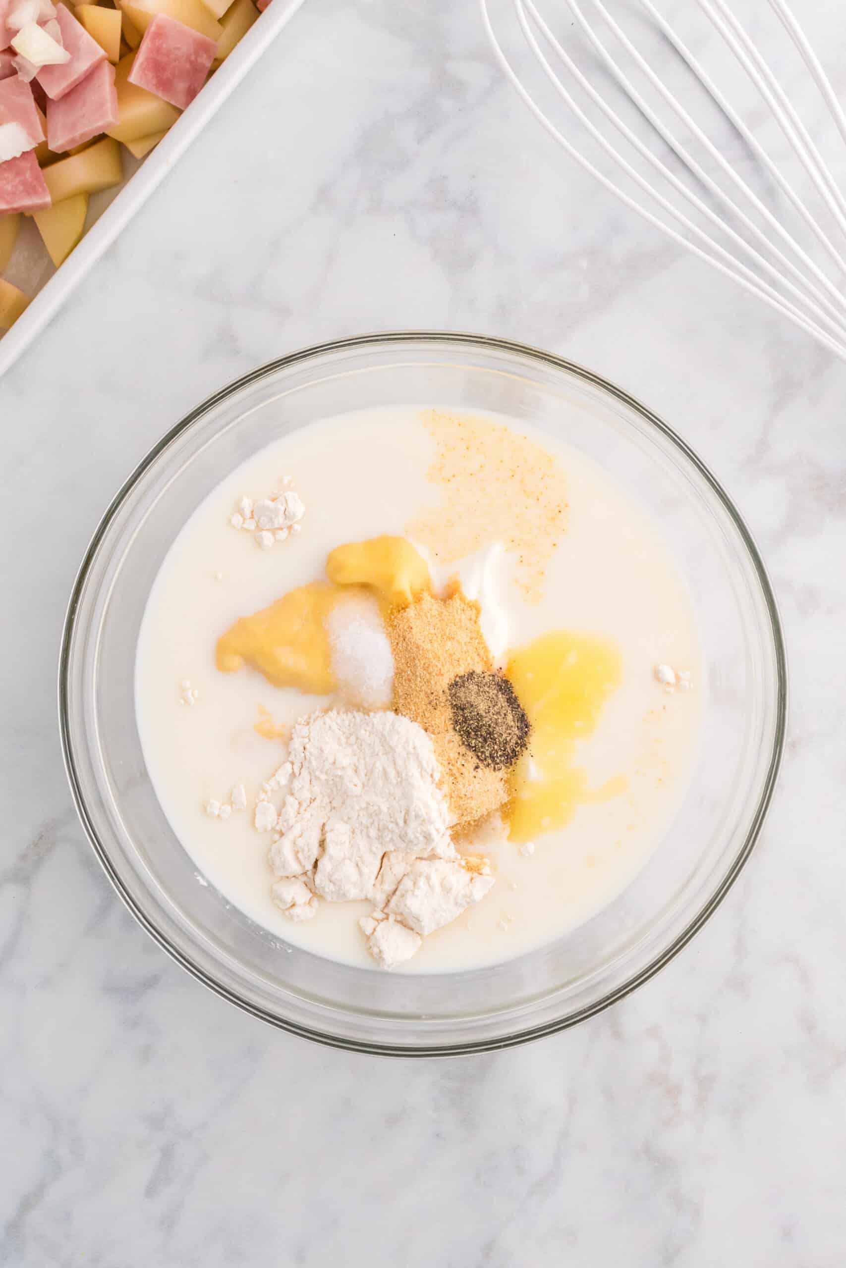 cream of chicken soup, sour cream, milk, flour and spices in a mixing bowl