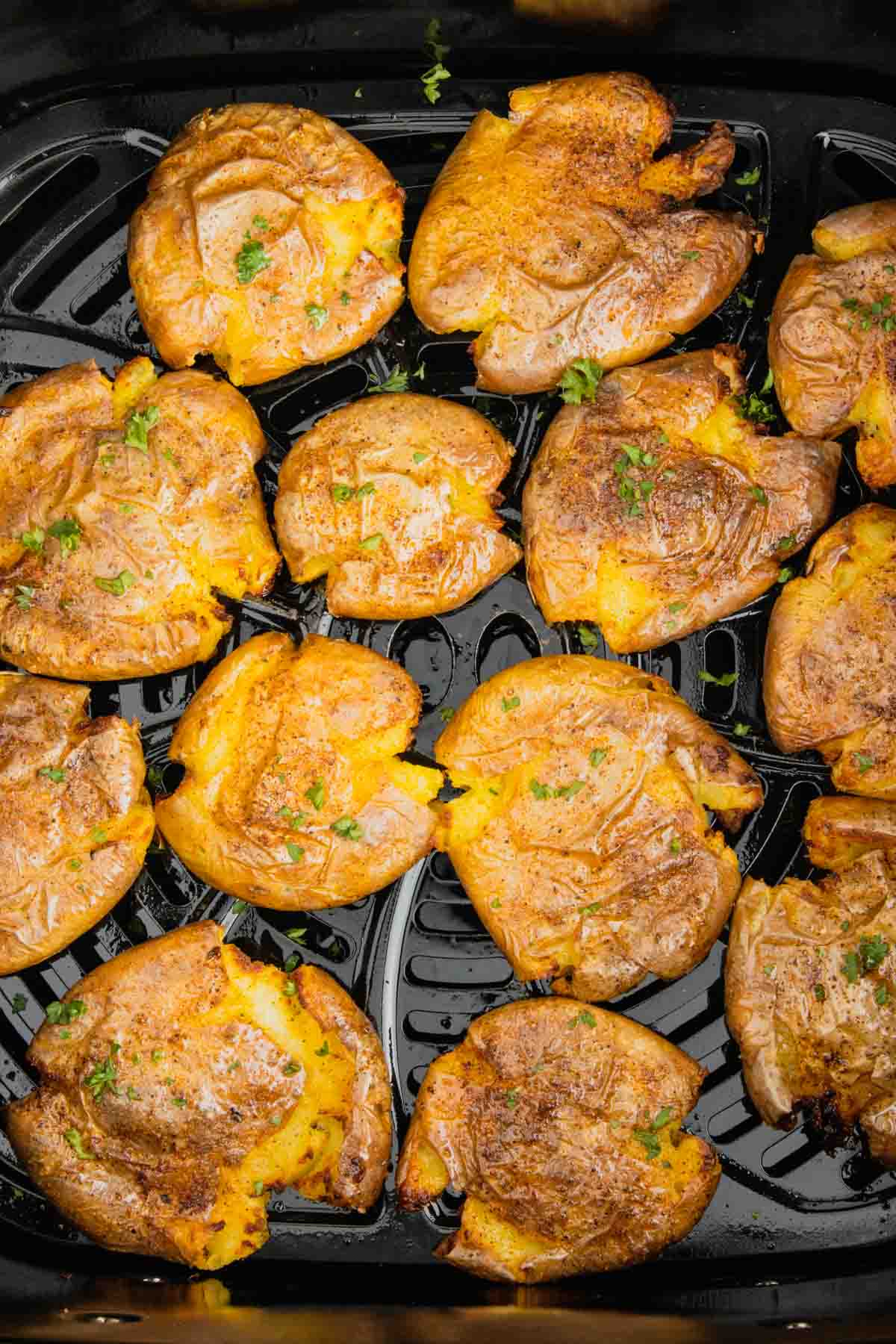 Air Fryer Smashed Potatoes are tasty seasoned baby potatoes with a crispy outside and a fluffy center.