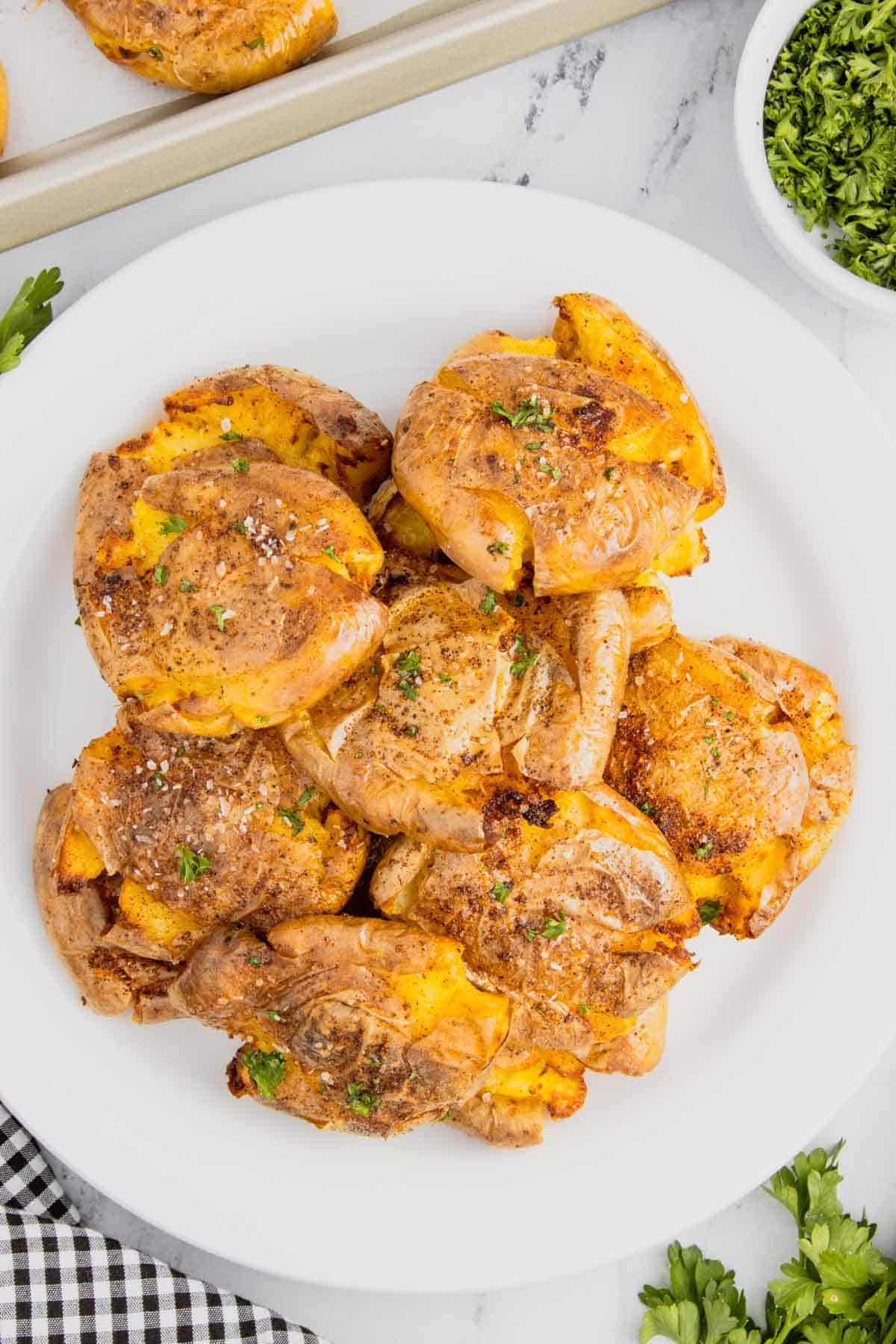 Air Fryer Smashed Potatoes are tasty seasoned baby potatoes with a crispy outside and a fluffy center.