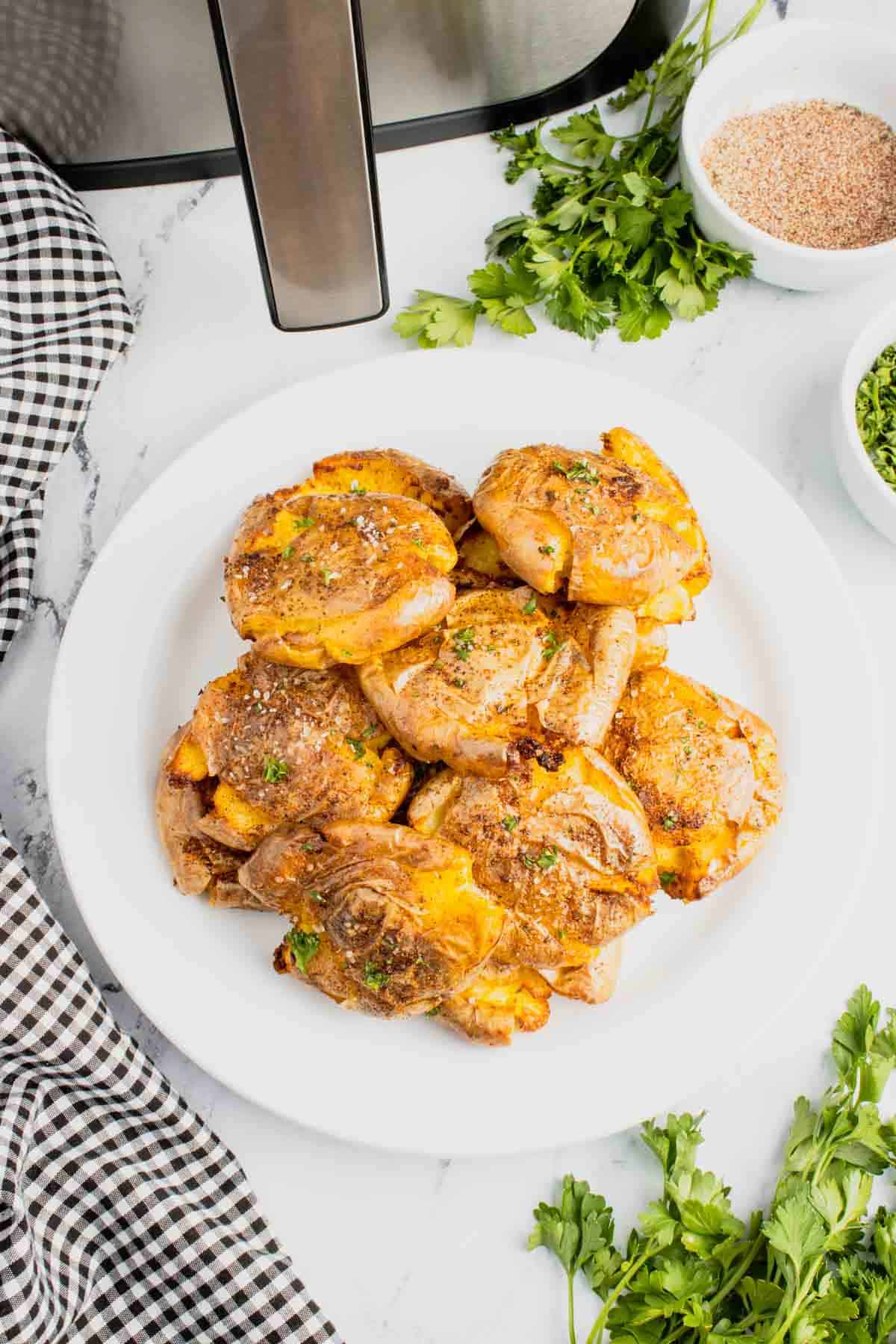 Air Fryer Smashed Potatoes are tasty seasoned baby potatoes with a crispy outside and a fluffy center.