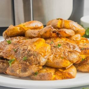 Air Fryer Smashed Potatoes are tasty seasoned baby potatoes with a crispy outside and a fluffy center.