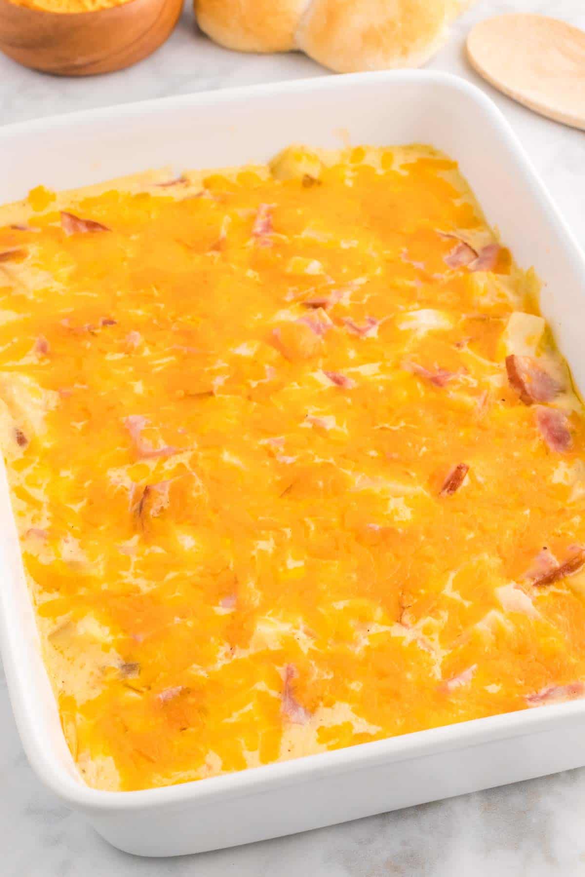 Cheesy Ham and Potato Casserole is a hearty dish loaded with diced potatoes, ham and onions all covered in a creamy sauce and baked with cheddar cheese on top.