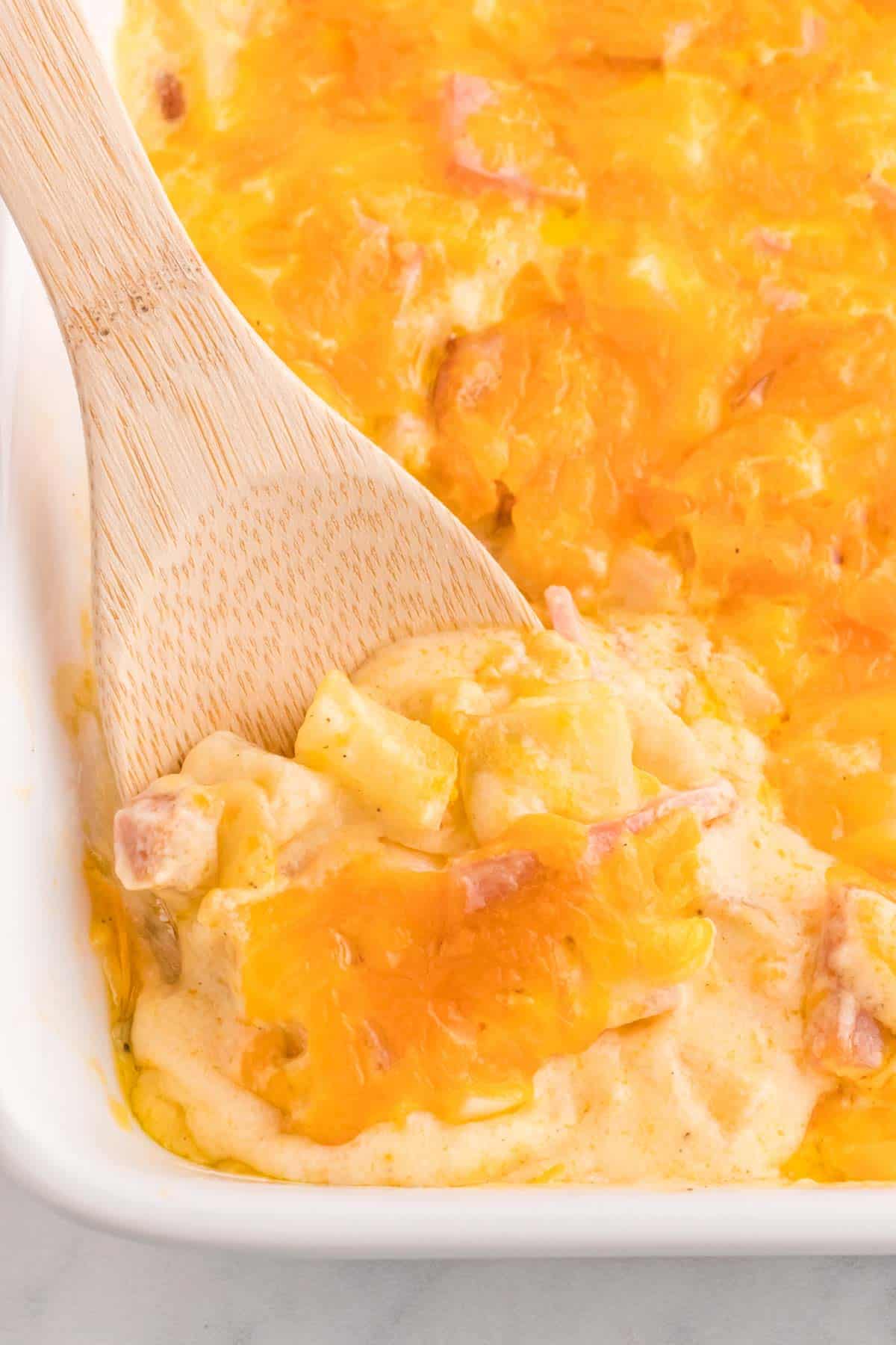 Cheesy Ham and Potato Casserole is a hearty dish loaded with diced potatoes, ham and onions all covered in a creamy sauce and baked with cheddar cheese on top.