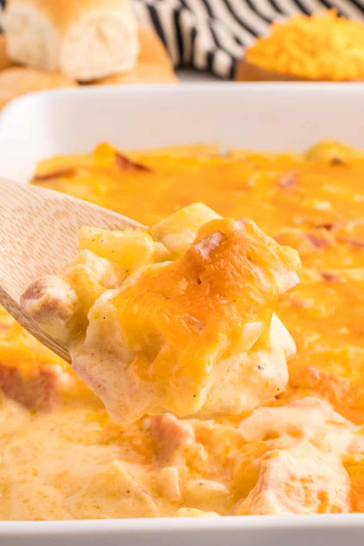 Cheesy Ham and Potato Casserole is a hearty dish loaded with diced potatoes, ham and onions all covered in a creamy sauce and baked with cheddar cheese on top.