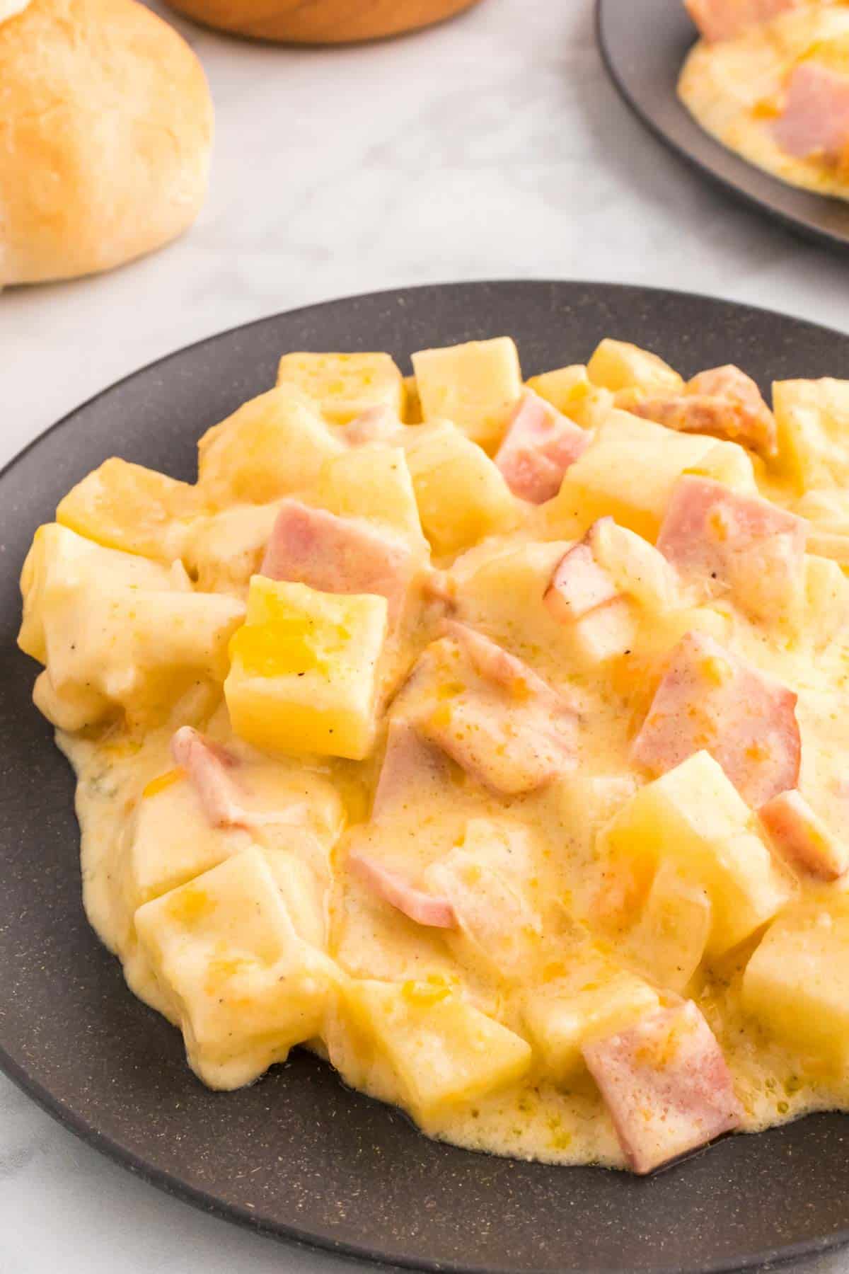 Cheesy Ham and Potato Casserole is a hearty dish loaded with diced potatoes, ham and onions all covered in a creamy sauce and baked with cheddar cheese on top.