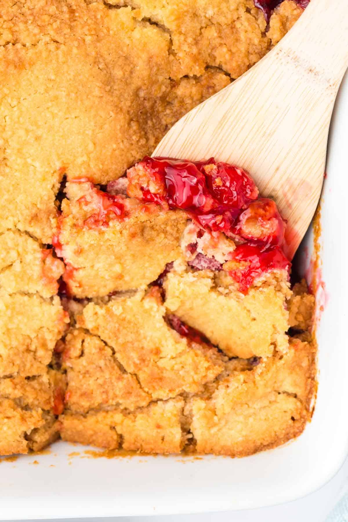 Cherry Dump Cake is an easy dessert recipe made with cherry pie filling, vanilla cake mix, crumbled butter cookies, vanilla extract and butter.