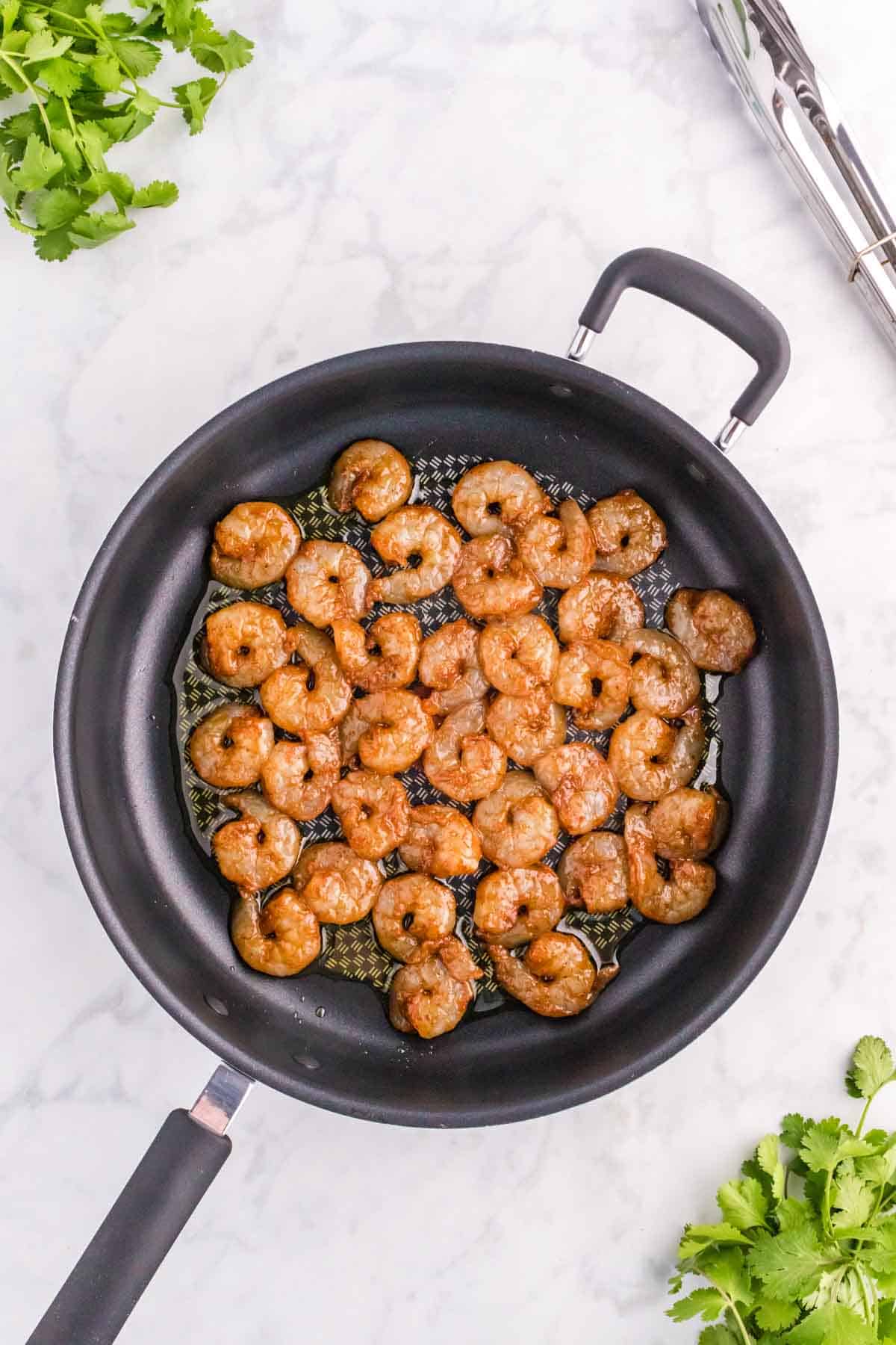 seasoned shrimp in a skillet