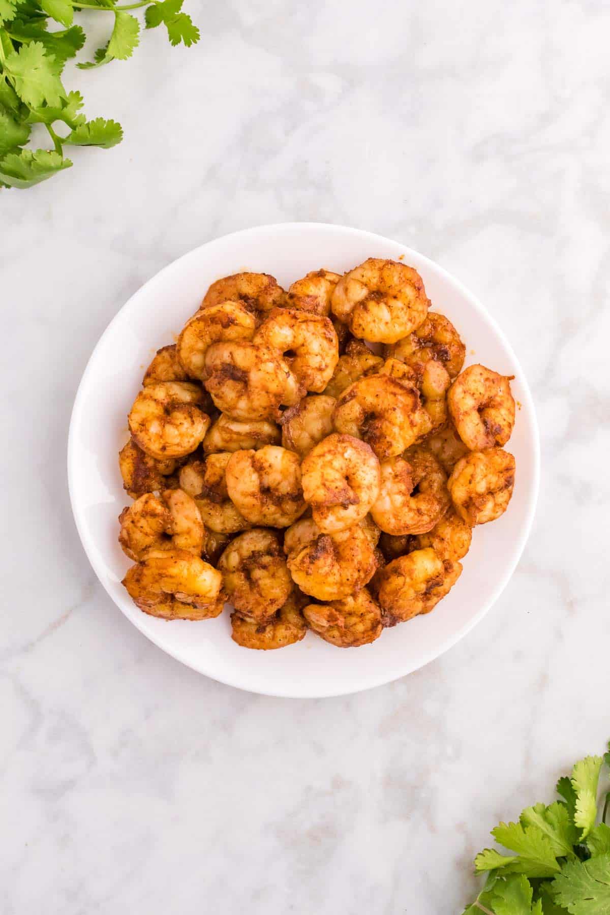 cooked seasoned shrimp on a plate