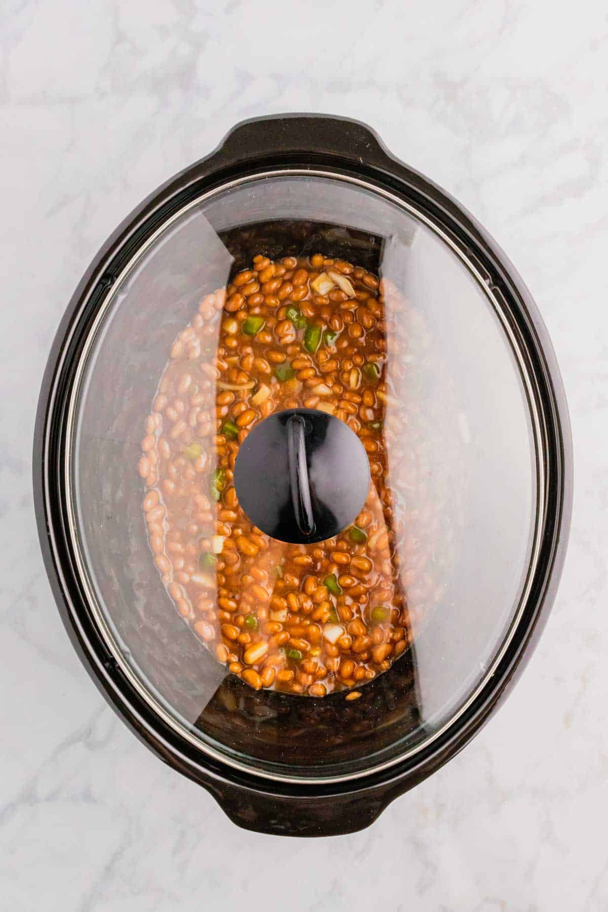 baked beans in a crock pot with lid on