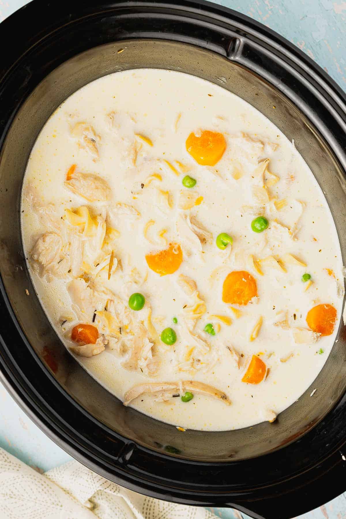 Crock Pot Creamy Chicken Noodle Soup is a hearty soup loaded with shredded chicken, veggies and egg noodles all in a creamy chicken chicken broth.