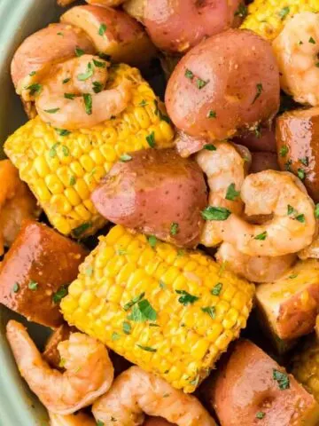 Crock Pot Shrimp Boil is a hearty slow cooker dish loaded with baby red potatoes, corn on the cob, smoked sausage and shrimp.