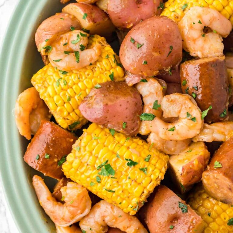 Crock Pot Shrimp Boil is a hearty slow cooker dish loaded with baby red potatoes, corn on the cob, smoked sausage and shrimp.