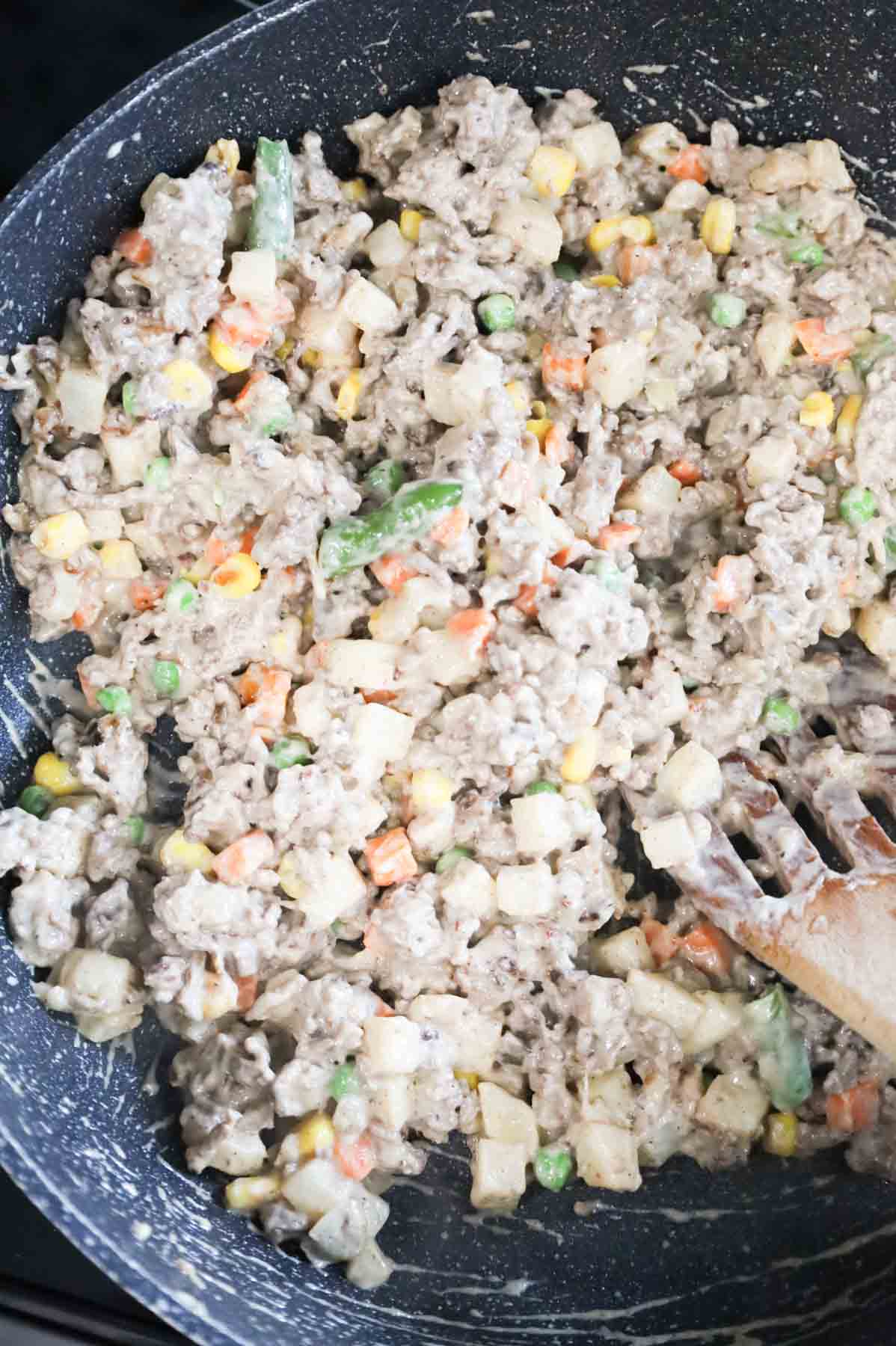 ground beef, veggie and mushroom soup mixture in a skillet