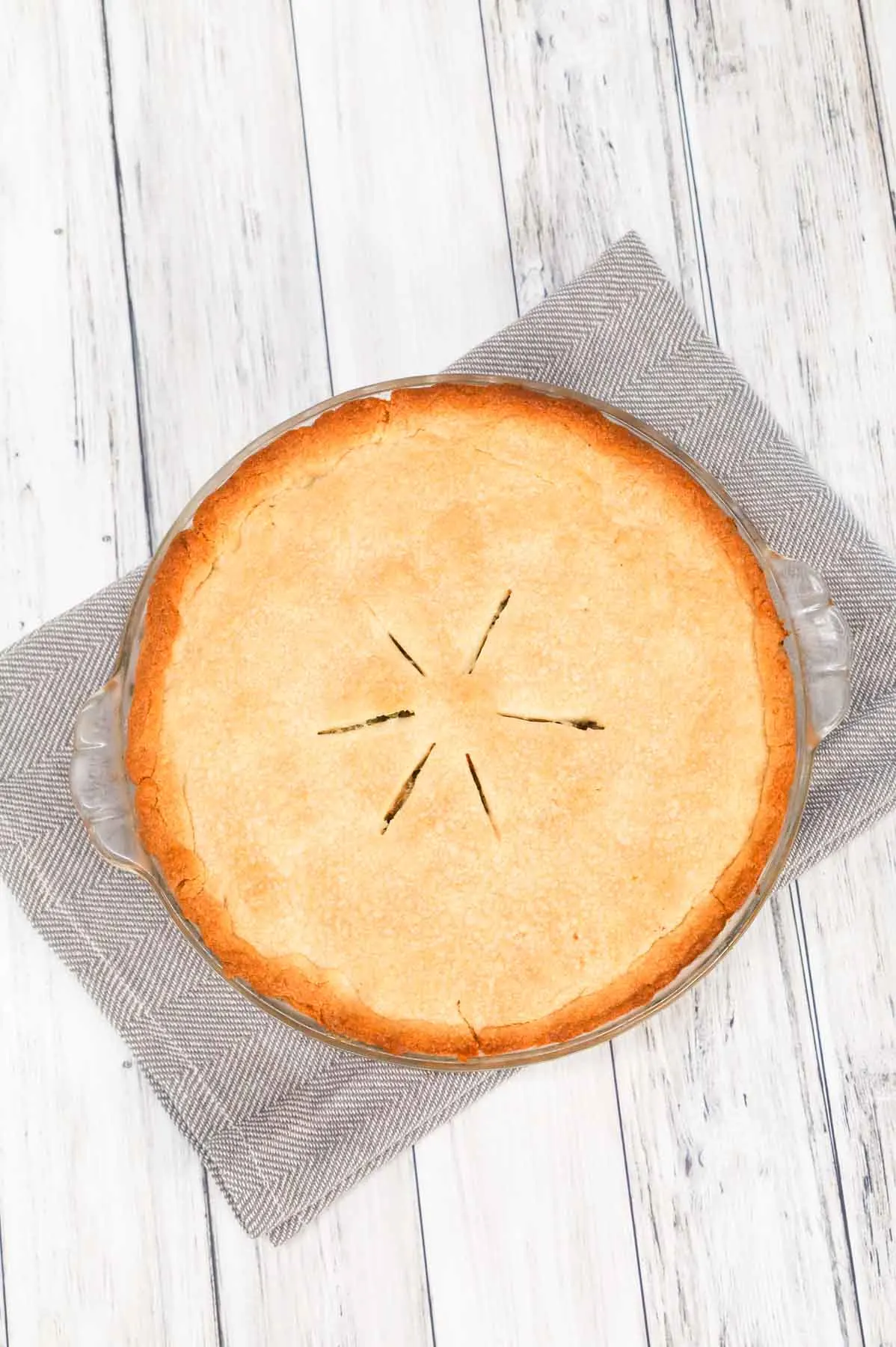 Ground Beef Pot Pie is an easy weeknight dinner recipe made with store bought pie crust and filled with ground beef and mixed vegetables all tossed in cream of mushroom soup.