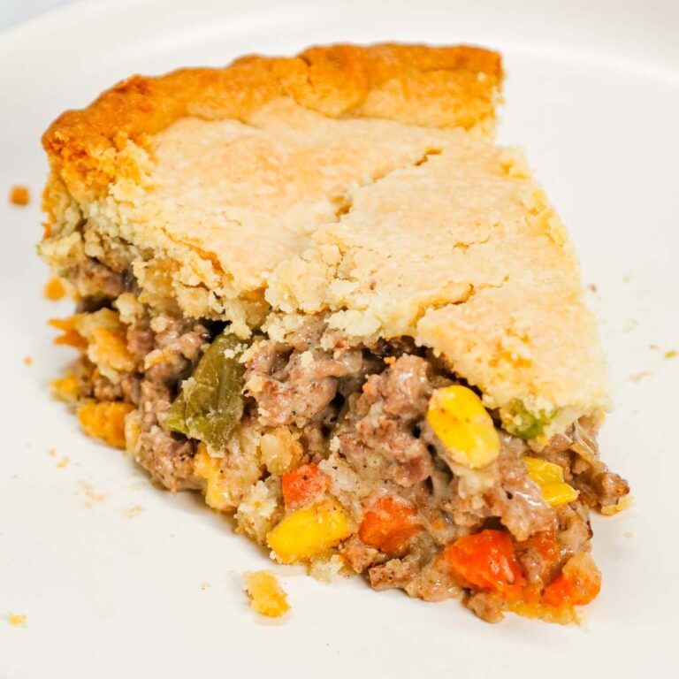 Ground Beef Pot Pie is an easy weeknight dinner recipe made with store bought pie crust and filled with ground beef and mixed vegetables all tossed in cream of mushroom soup.