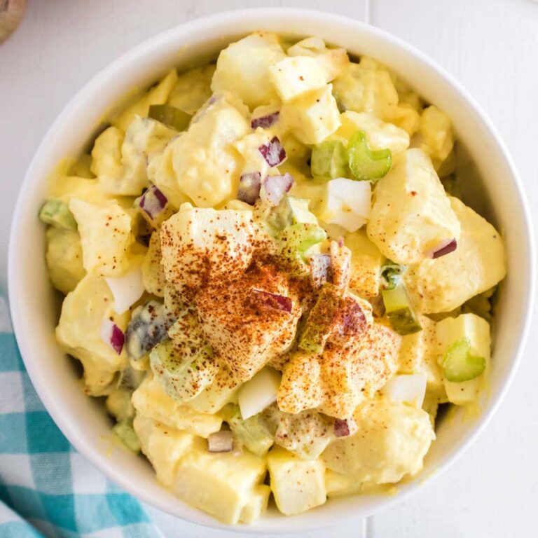 Southern Potato Salad is a classic side dish recipe loaded with cubes of russet potatoes, chopped hard boiled eggs, celery, red onions and dill pickles all tossed in a mayo based dressing and seasoned with paprika.