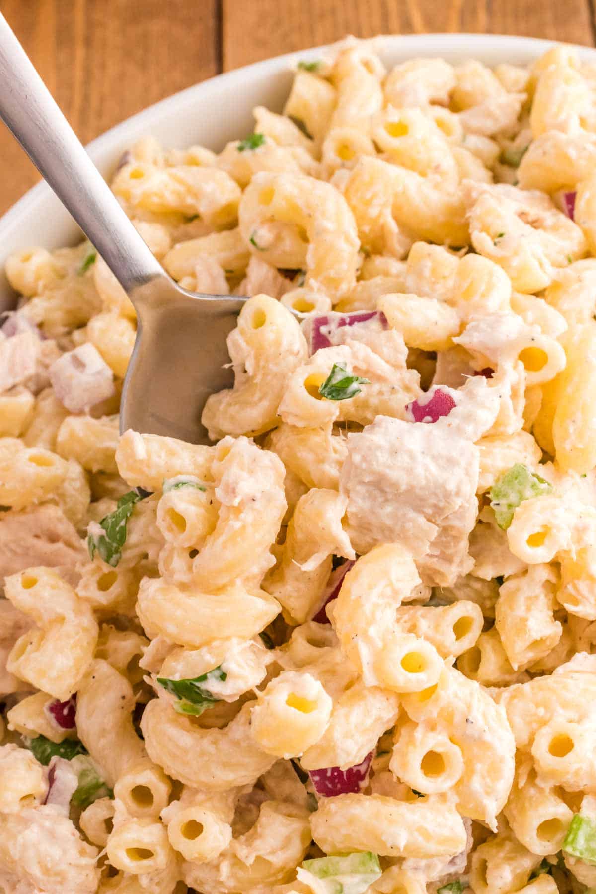 Tuna Macaroni Salad is a classic pasta salad recipe loaded with canned tuna, chopped celery, diced red onions and green peppers all tossed in a seasoned mayo dressing.