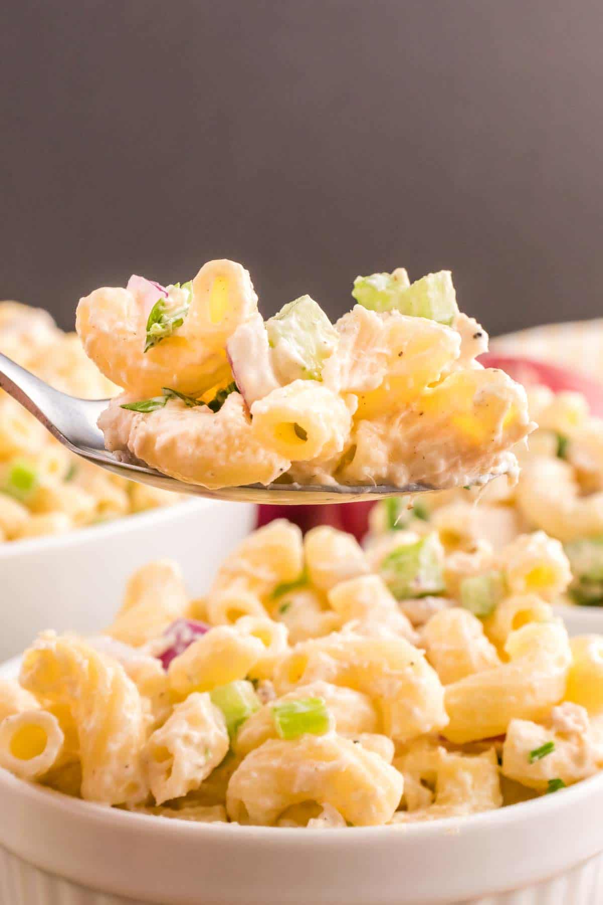 Tuna Macaroni Salad is a classic pasta salad recipe loaded with canned tuna, chopped celery, diced red onions and green peppers all tossed in a seasoned mayo dressing.